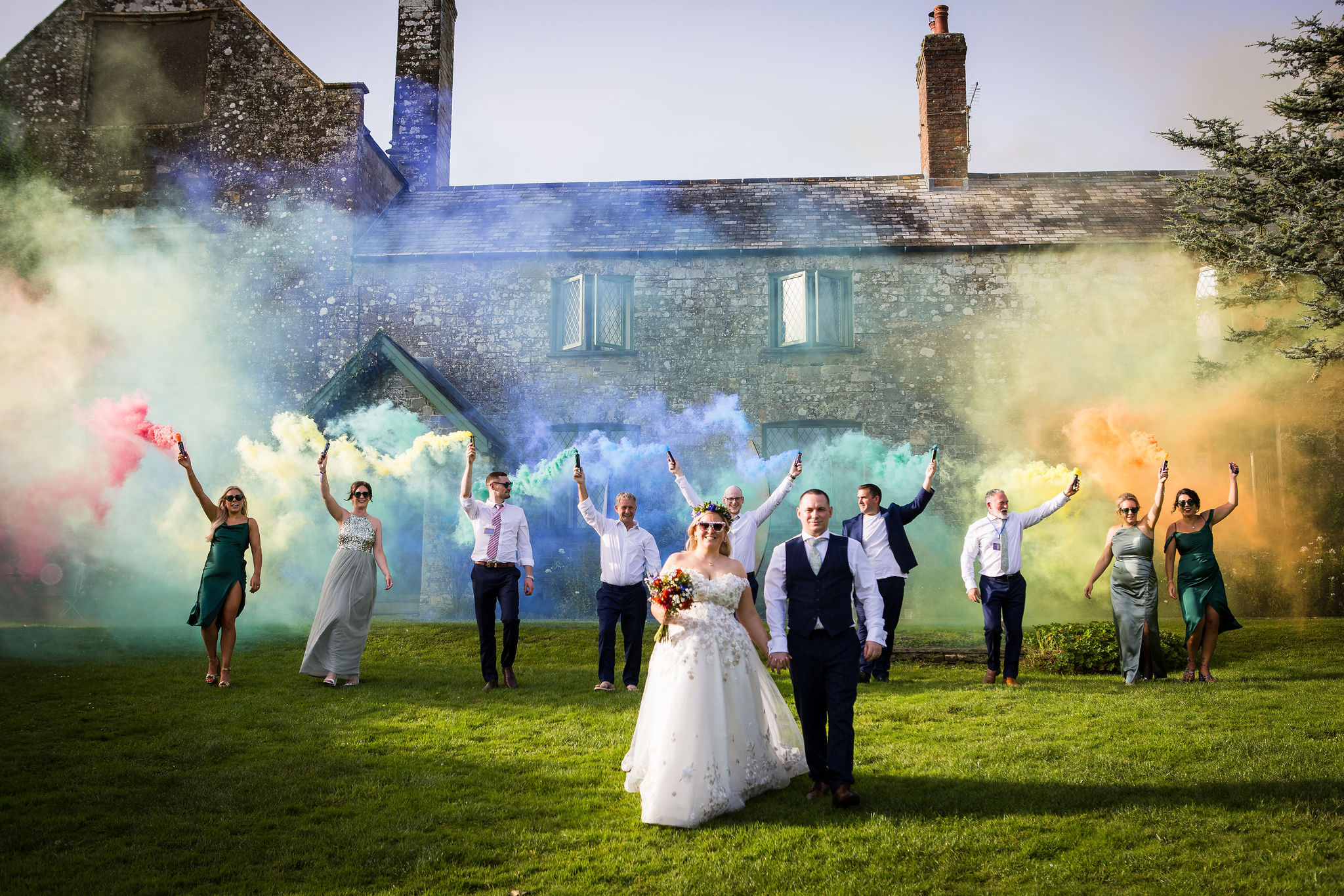 rainbow wedding photo with coloured smoke bombs