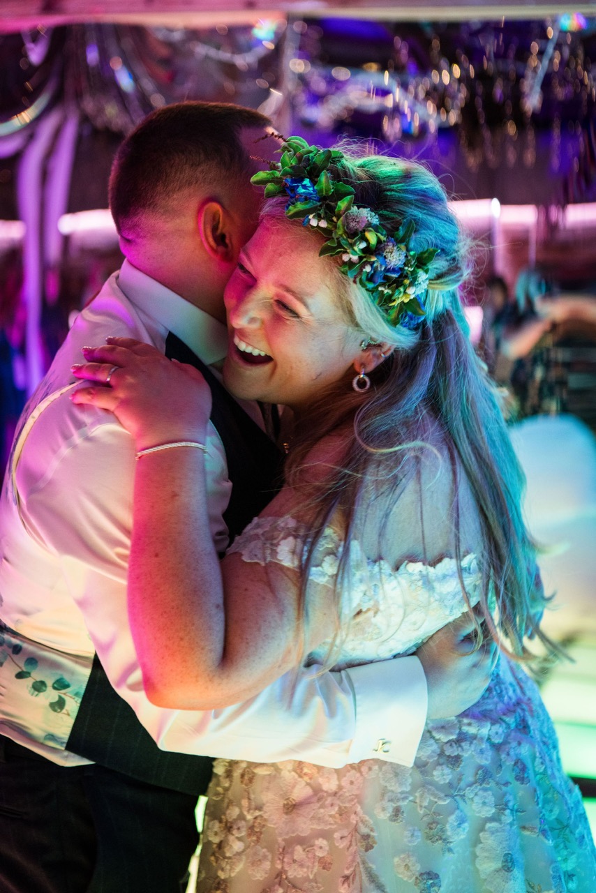 bride and groom smiling during their first dance