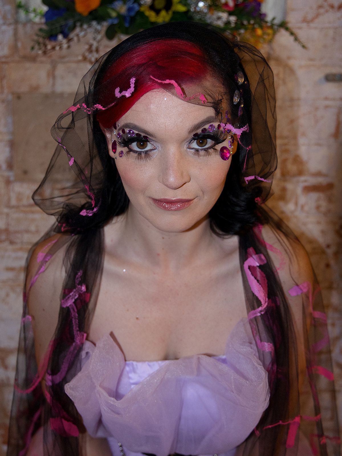 alternative bridal look with black and pink veil