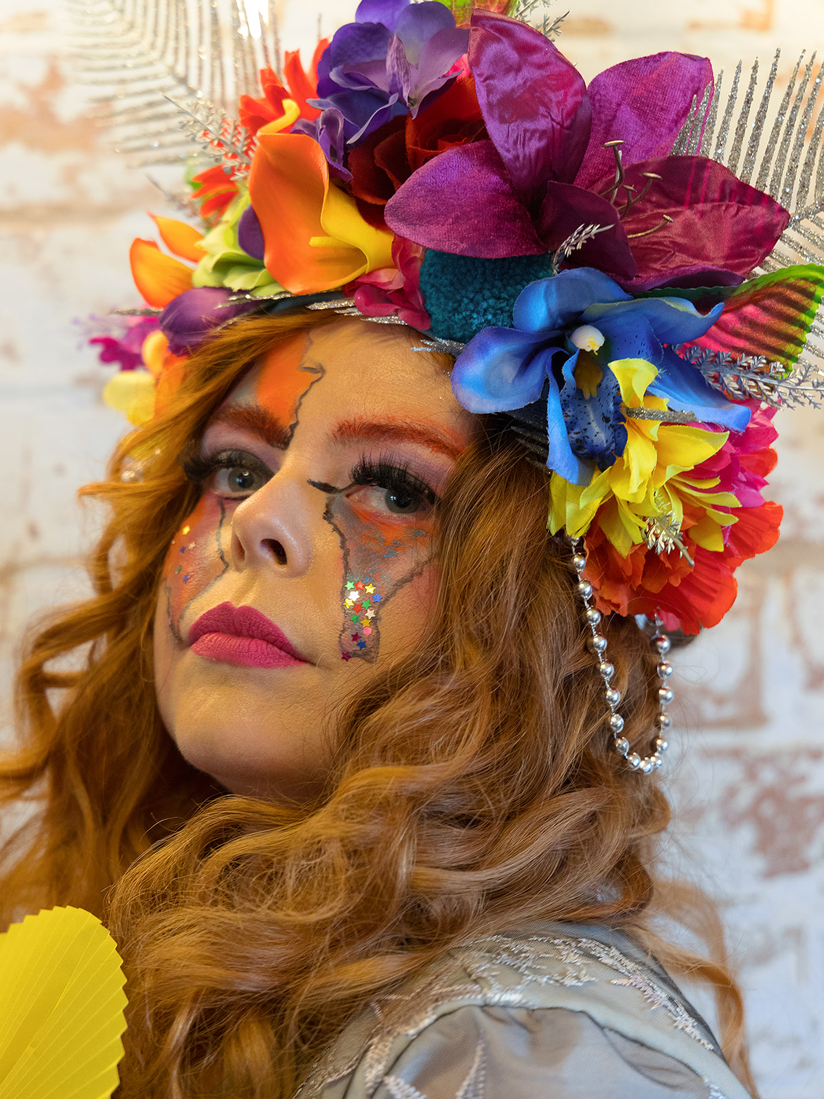 bride wearing colourful headdress and unique makeup