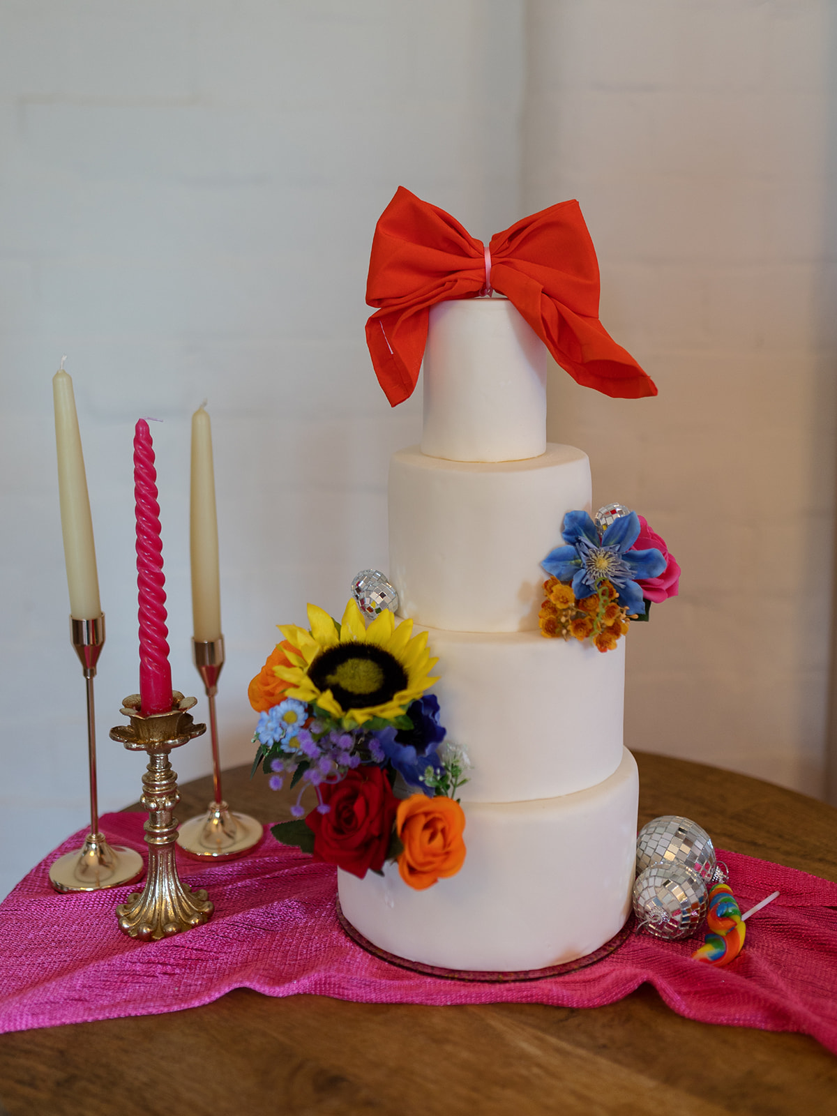 white wedding cake with colourful decoration
