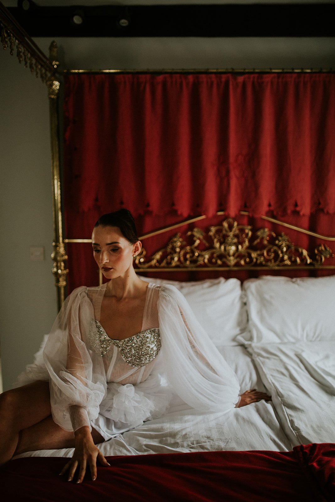 bridal portrait of bride wearing sparking corset and tule wedding robe