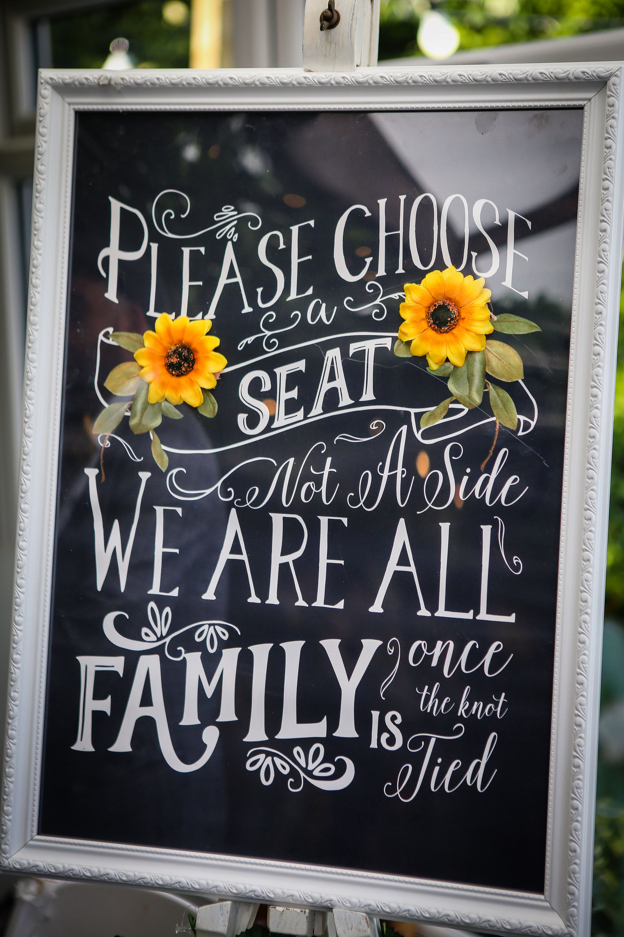 Harriet&Rhys Wedding - Magical sunflower wedding - choose a seat not a side we are all family