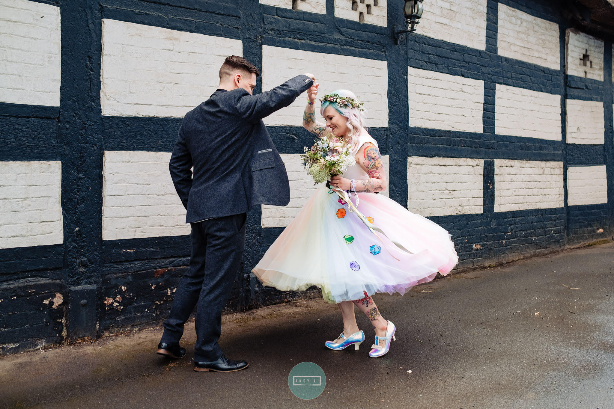 rainbow wedding dress by the little wedding shop - colourful wedding ideas with hand painted dice embellishments - dancing couple - quirky wedding dress ideas