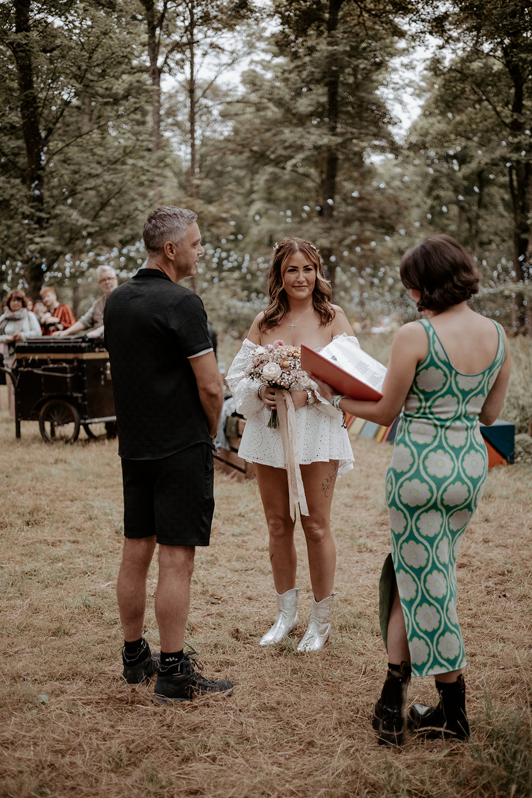 bride and groom having a celebrant led wedding at a festival