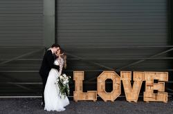 Emma DB Photography - Northampton wedding photographer - modern elegance - wooden love letters with couple