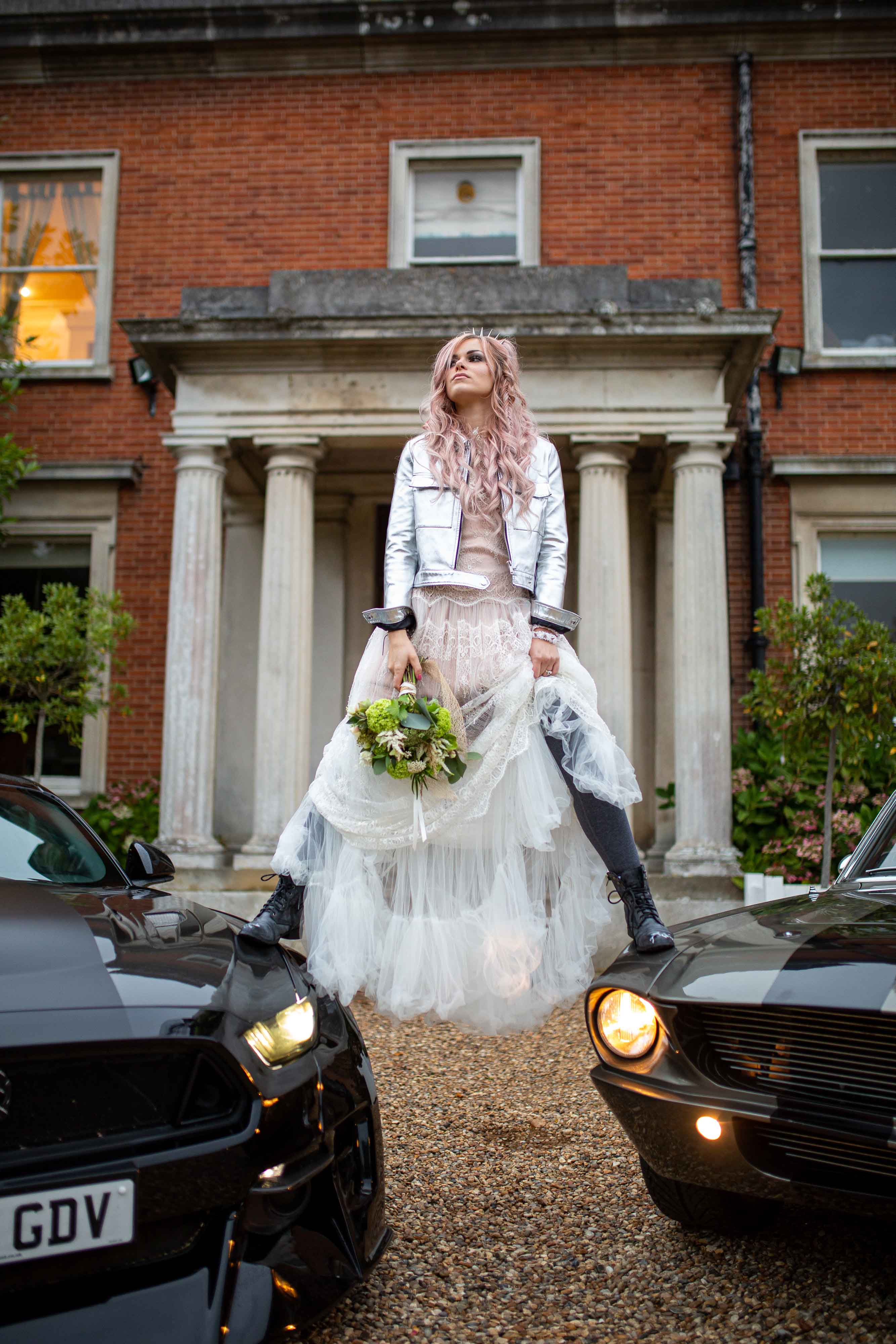 music themed wedding - unique wedding looks inspired by music icons - edgy wedding - rock and roll wedding - grunge wedding - courtney love style- bride standing on cars