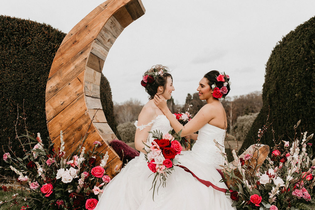 romantic woodland wedding - whimsical wedding- shakespeare wedding- unconventional wedding- romantic wedding photo- brides surrounded by roses