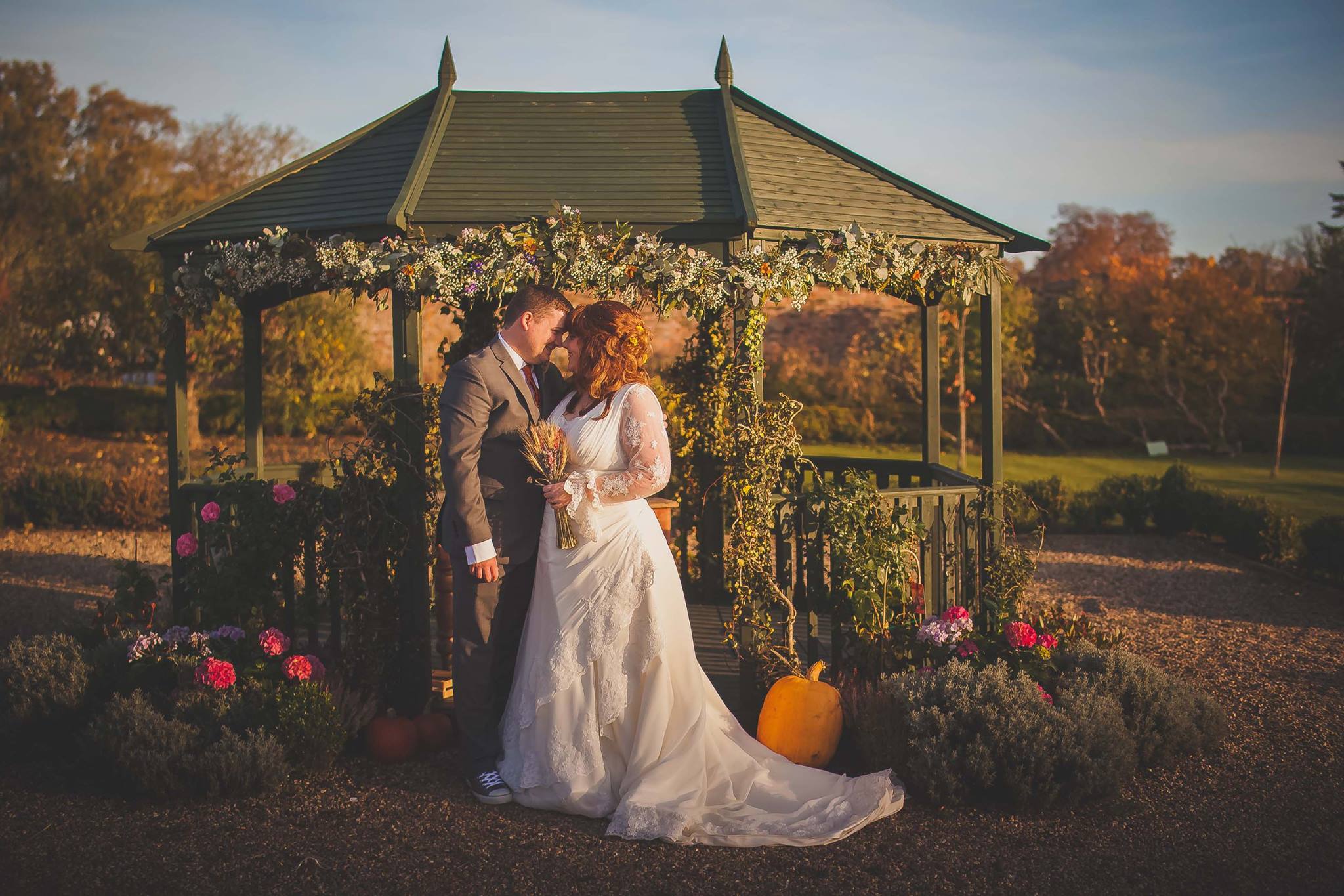 pumpkin wedding - halloween wedding ideas- couple shot with pumpkins