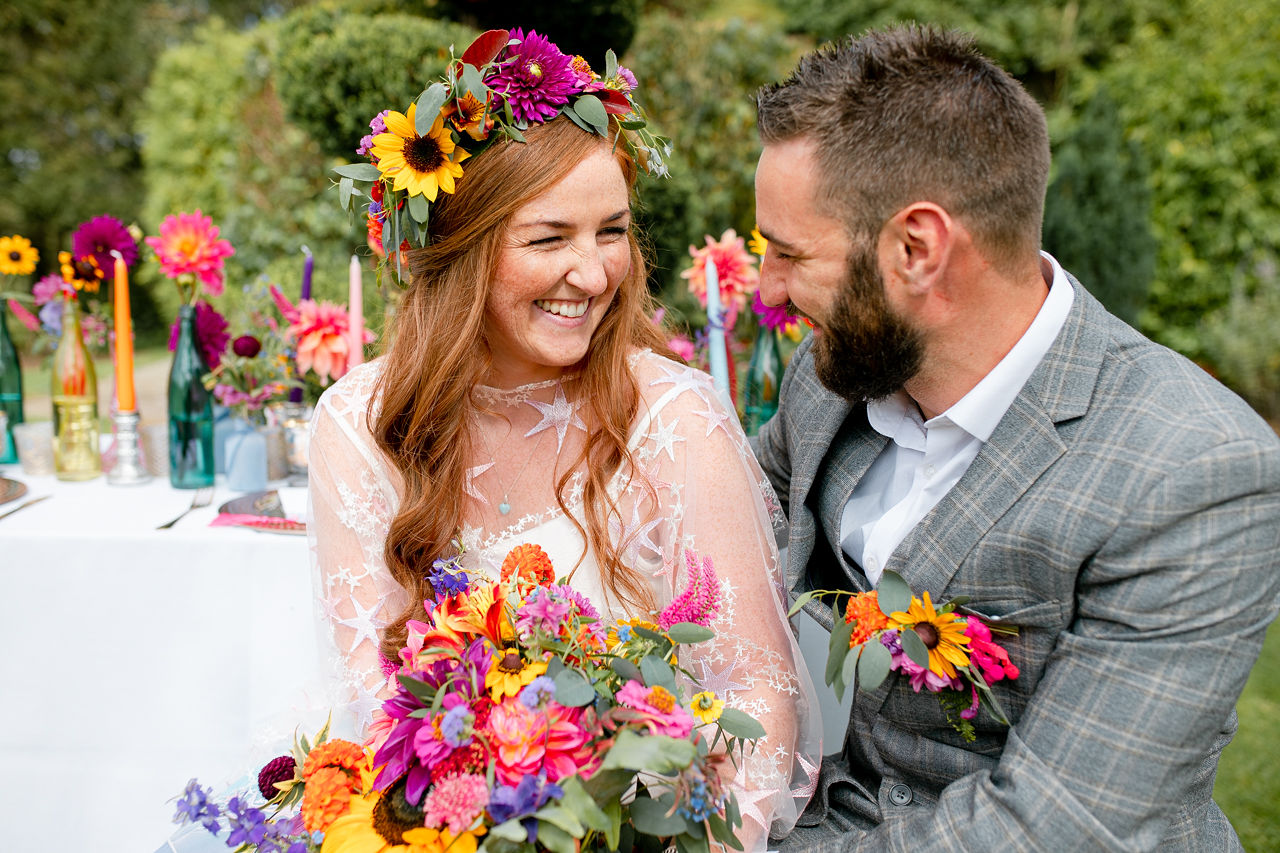 outdoor rainbow wedding- colourful wedding flowers - colourful flower crown - rainbow wedding decor