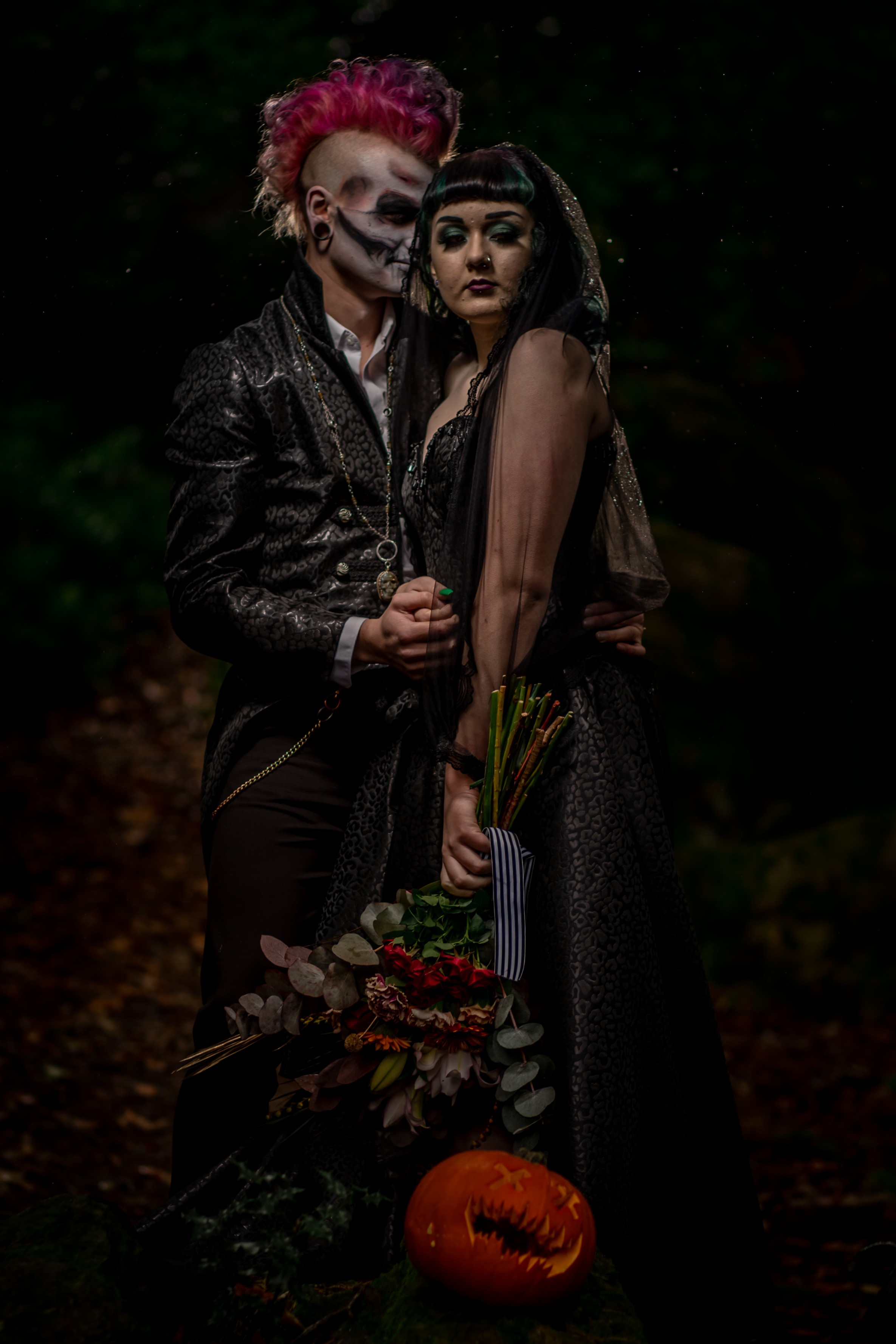 gothic wedding - bridal and groom in the dark - black corset wedding dress - pumpkin - bold, dramatic wedding look - groom mohawk pink hair