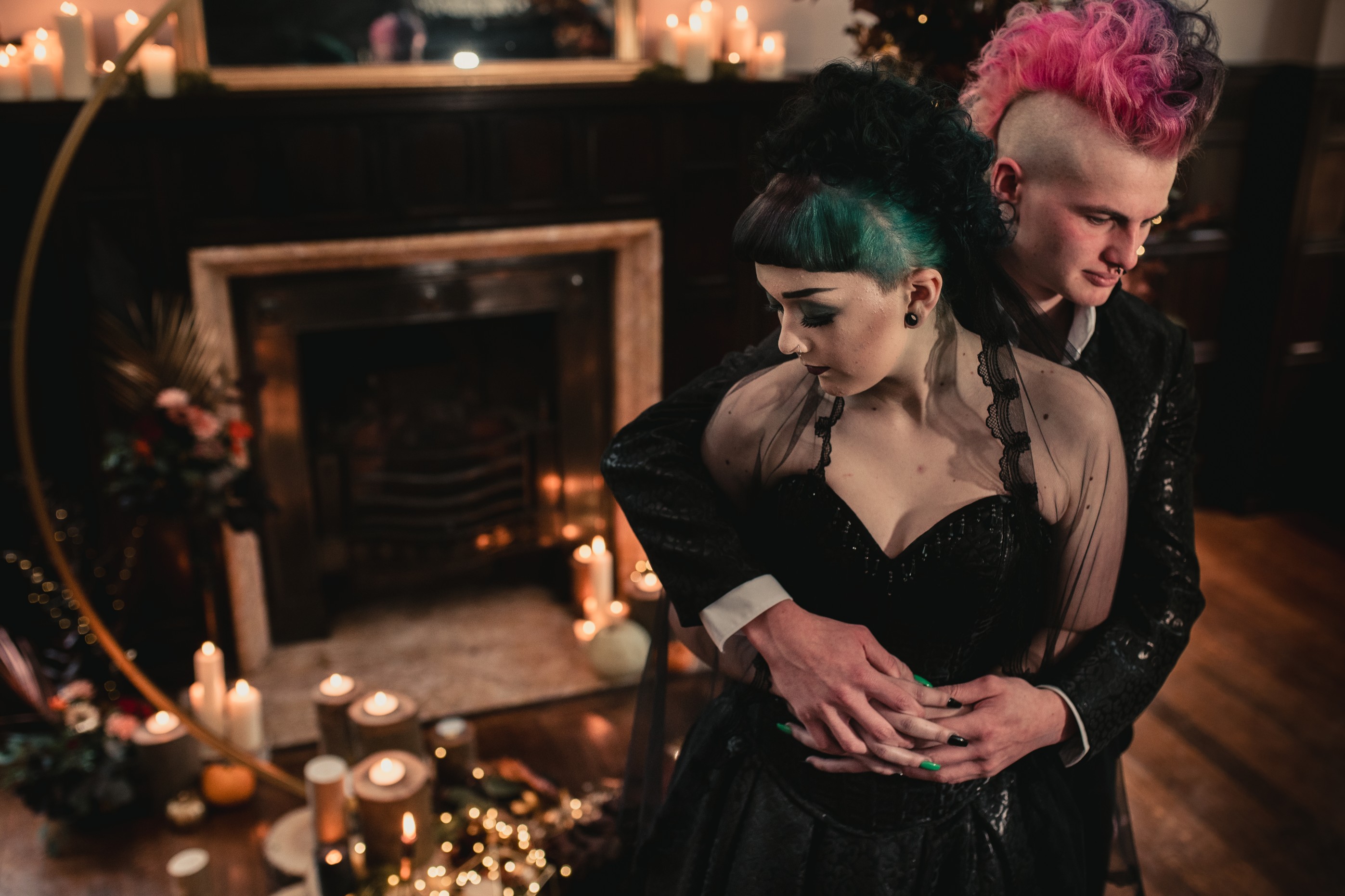 gothic halloween wedding ideas - contemporary wedding styling from the wedding alchemist in front of fireplace by candlelight