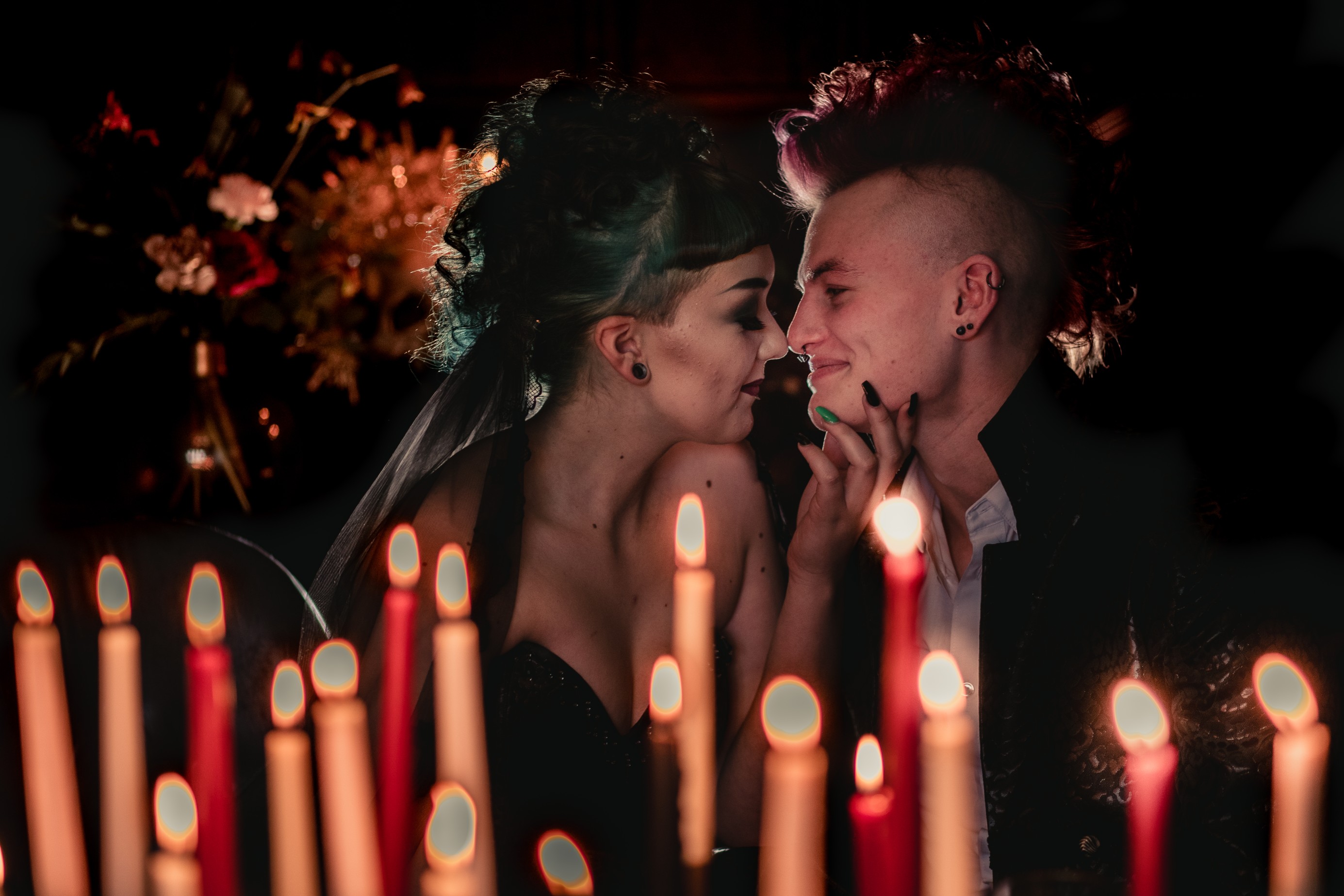 gothic halloween wedding couple by candlelight with mohawk wedding hair