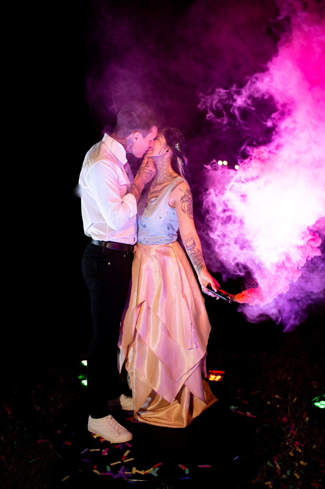 rainbow festival wedding - smoke bomb wedding photo - bride and groom with pink smoke bomb