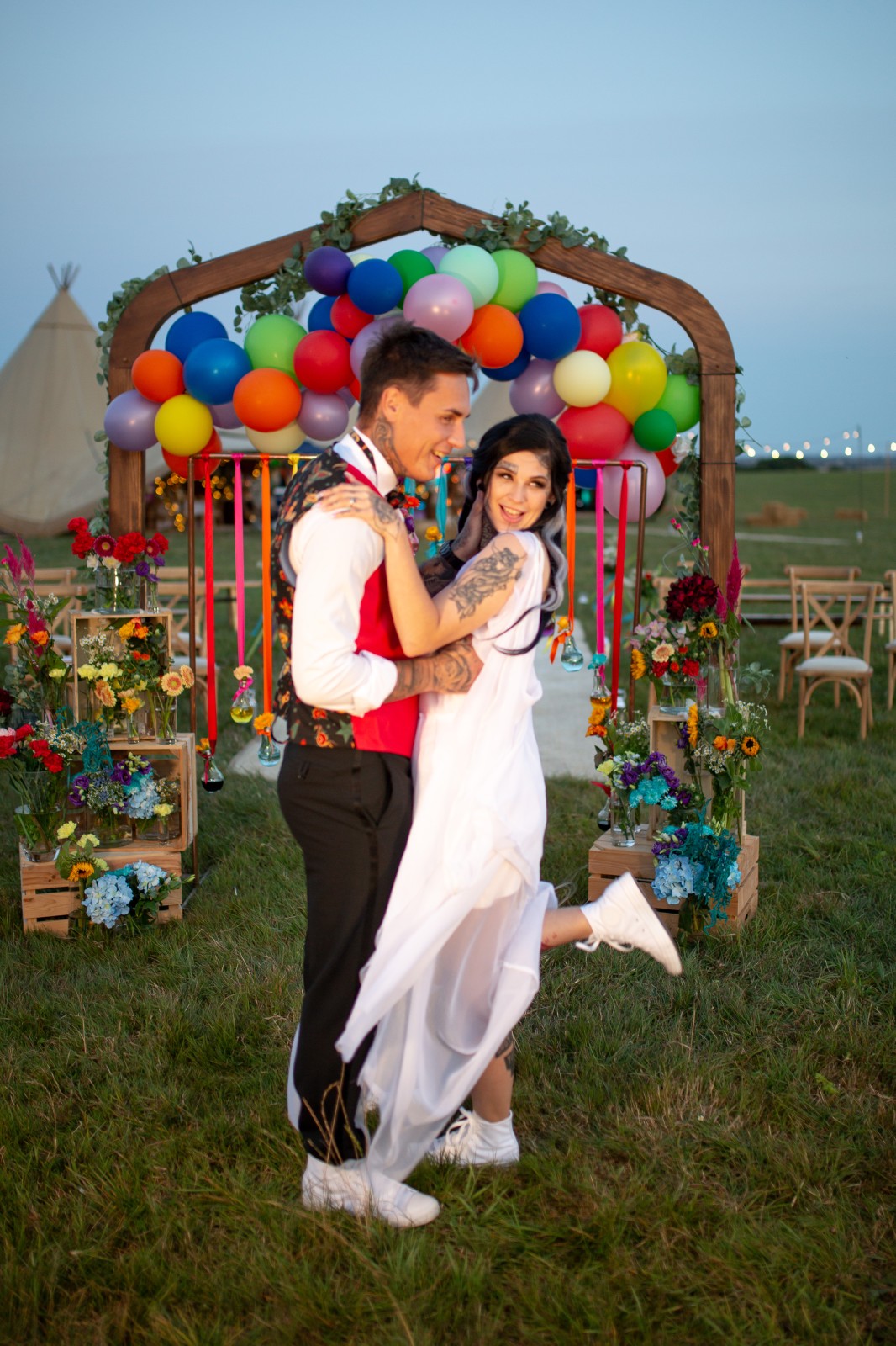 rainbow festival wedding - colourful wedding - quirky wedding ideas - colourful wedding ceremony - rainbow wedding arch