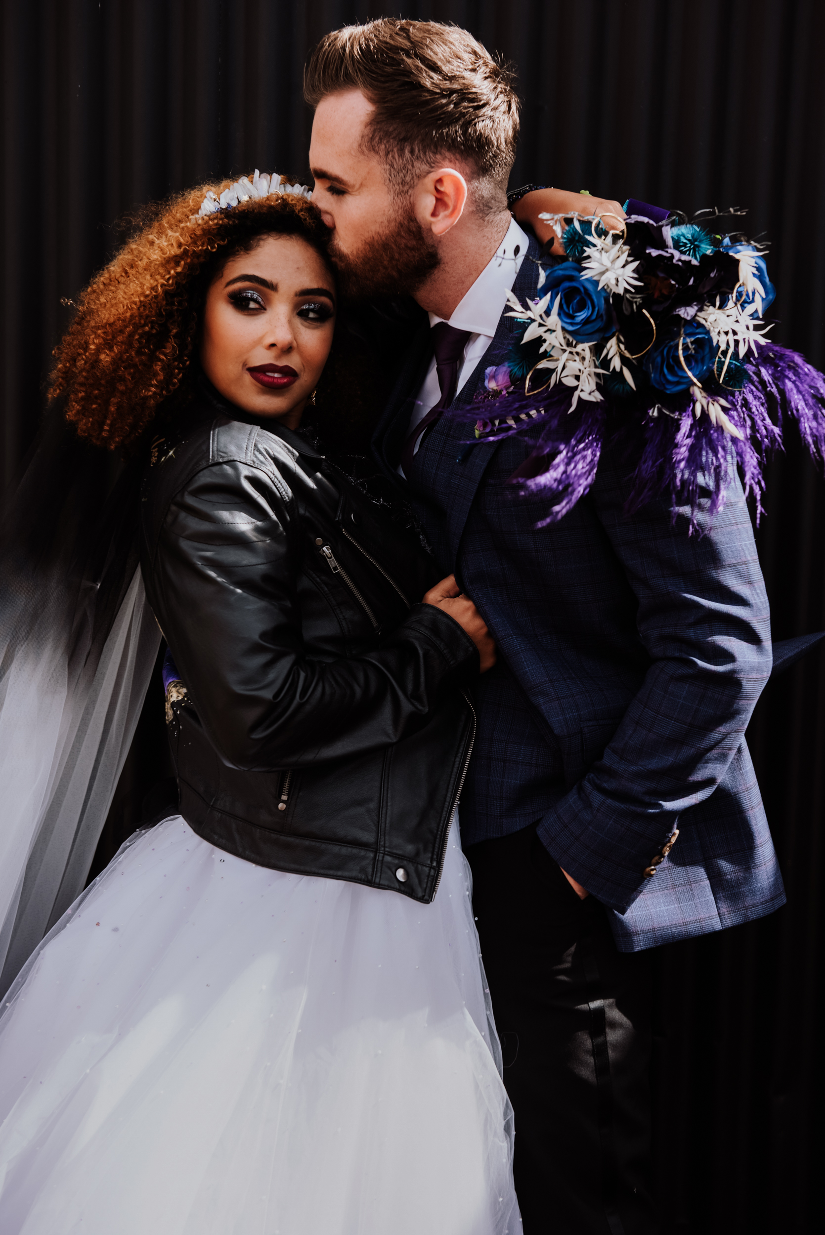 luxury galaxy wedding - bride in leather jacket with unique wedding flowers