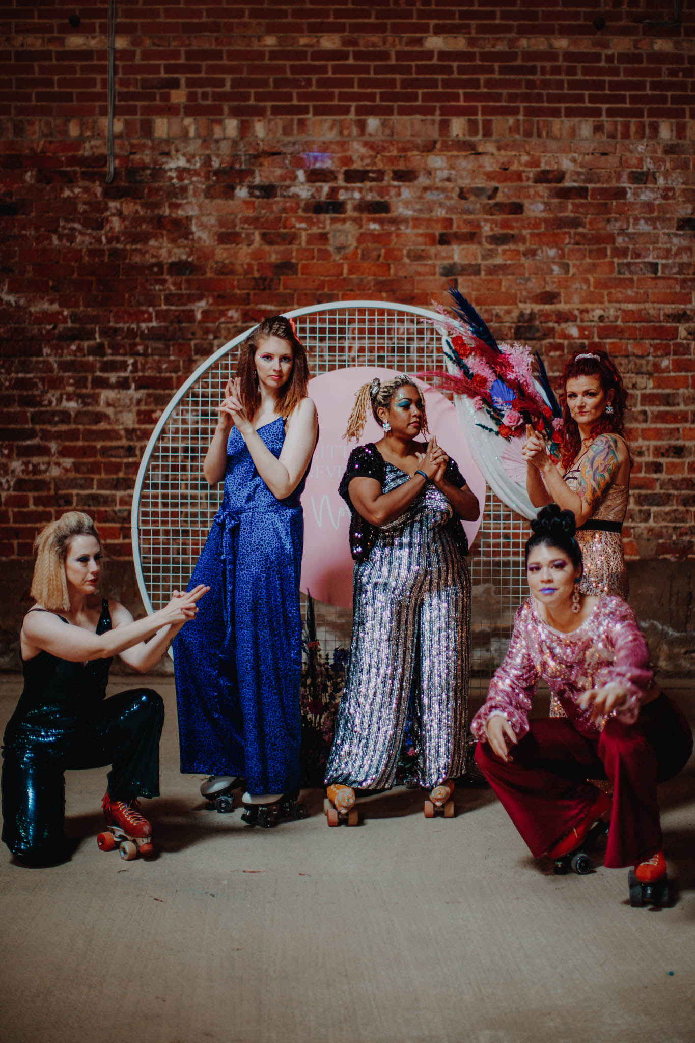 roller disco wedding - bridesmaids on roller skates - bridesmaid jumpsuits - unique bridesmaid ideas - fun bridesmaids photos