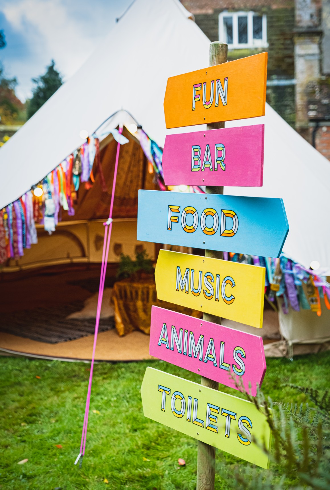 colourful micro wedding at patricks barn - festival wedding signage - unique wedding signs - festival wedding - colourful wedding - boho wedding