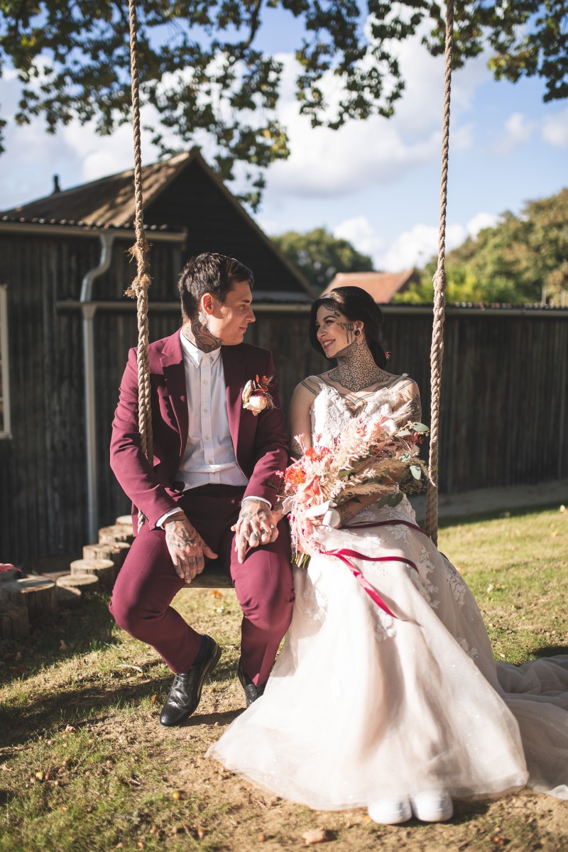 kent outdoor wedding venue - modern outdoor wedding venue - bride and groom in rope swing -unconventional wedding