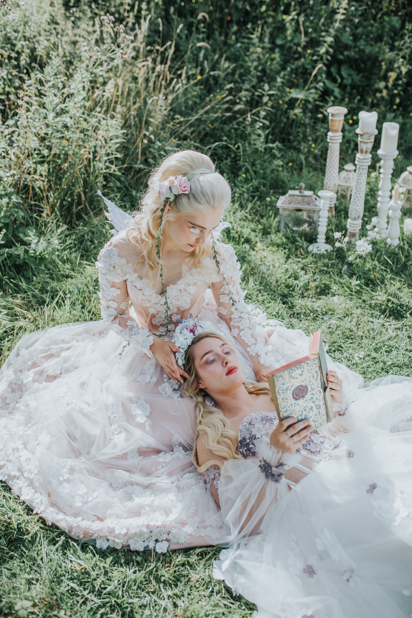 fairy wedding - whimsical wedding - magical wedding - elegant wedding dress - two brides sitting on grass