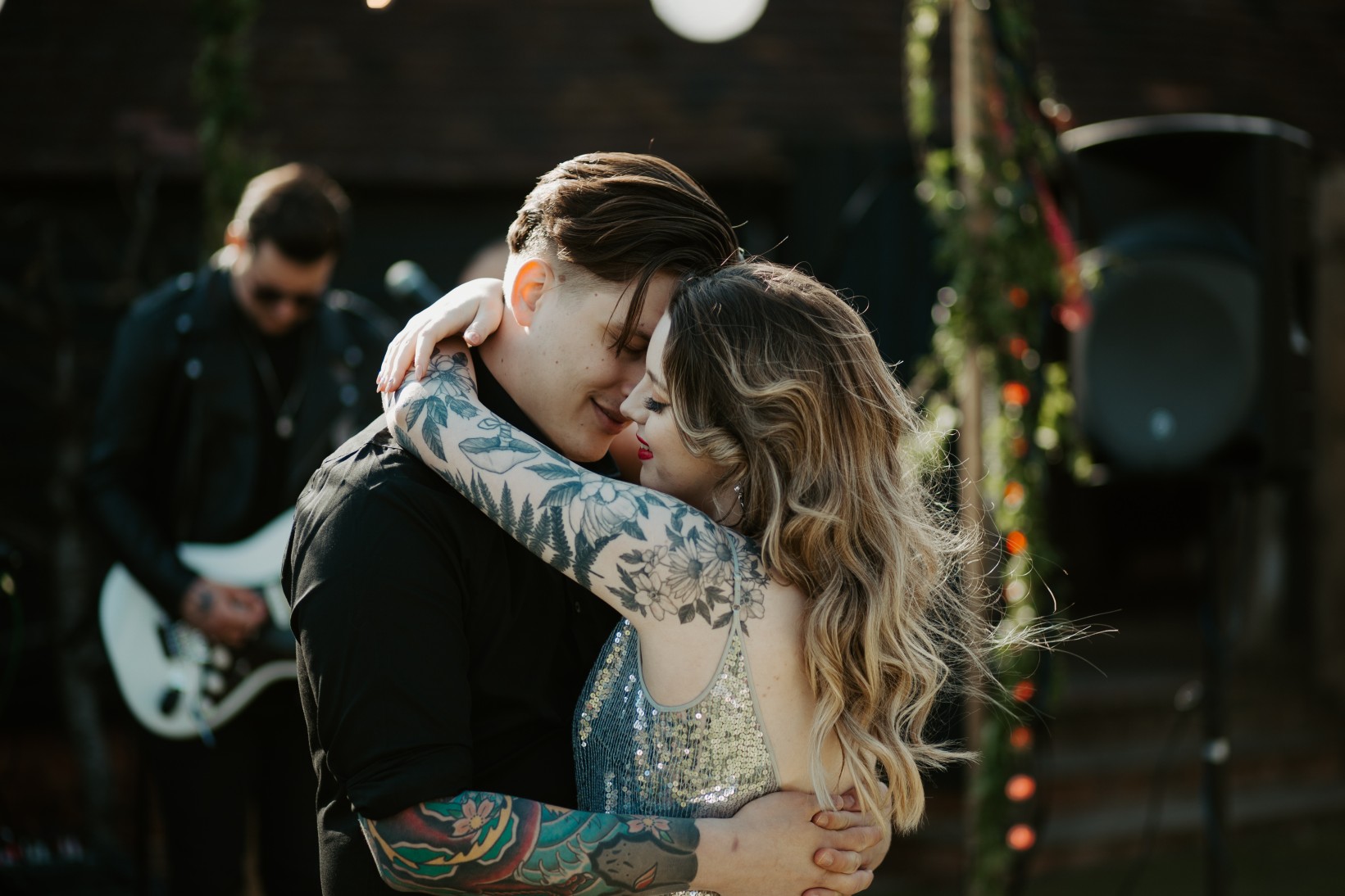 rock and roll wedding - edgy wedding inspiration - tattooed bride and groom dancing
