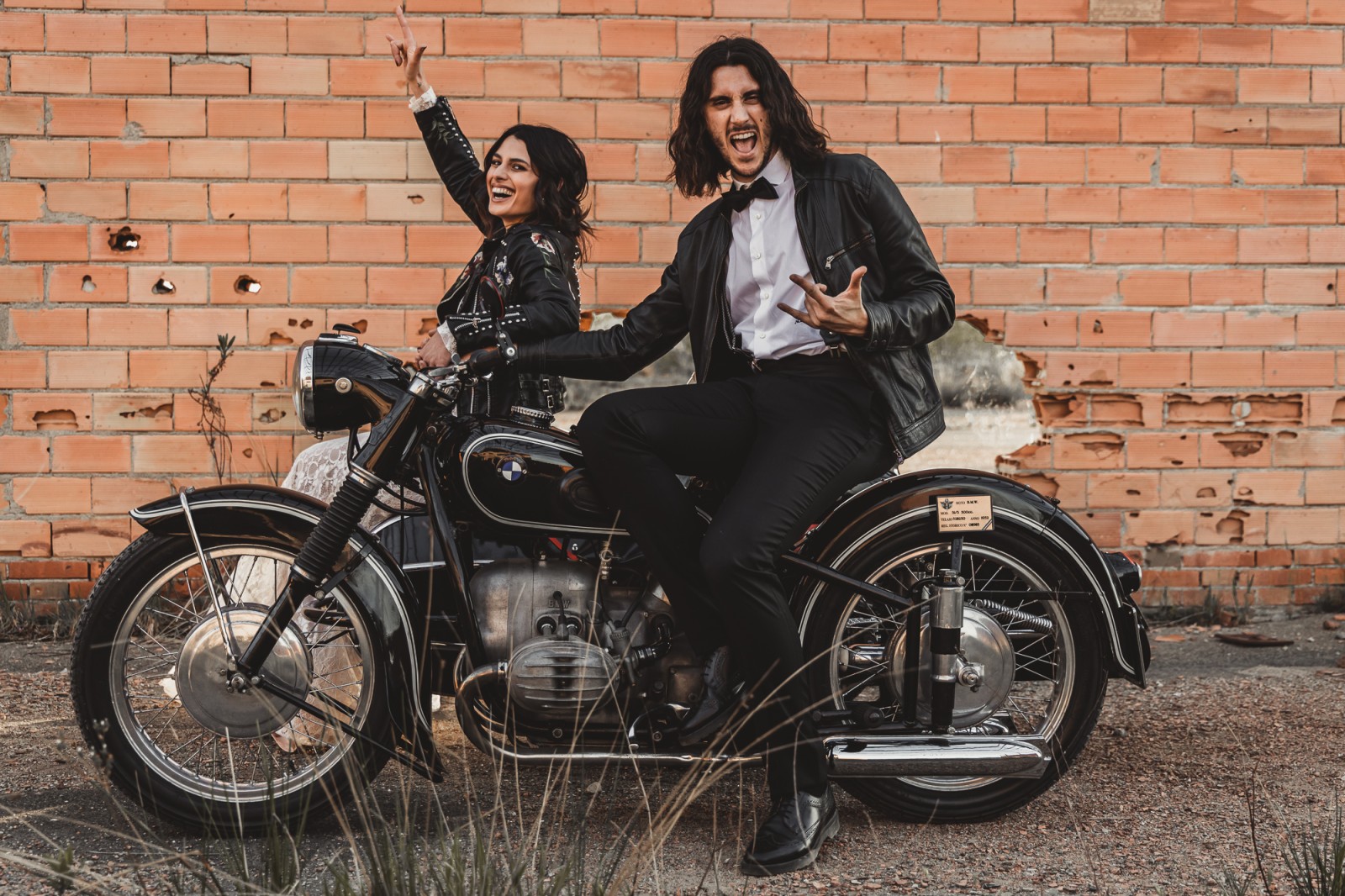 bride and groom on motorcycle wearing leather jackets