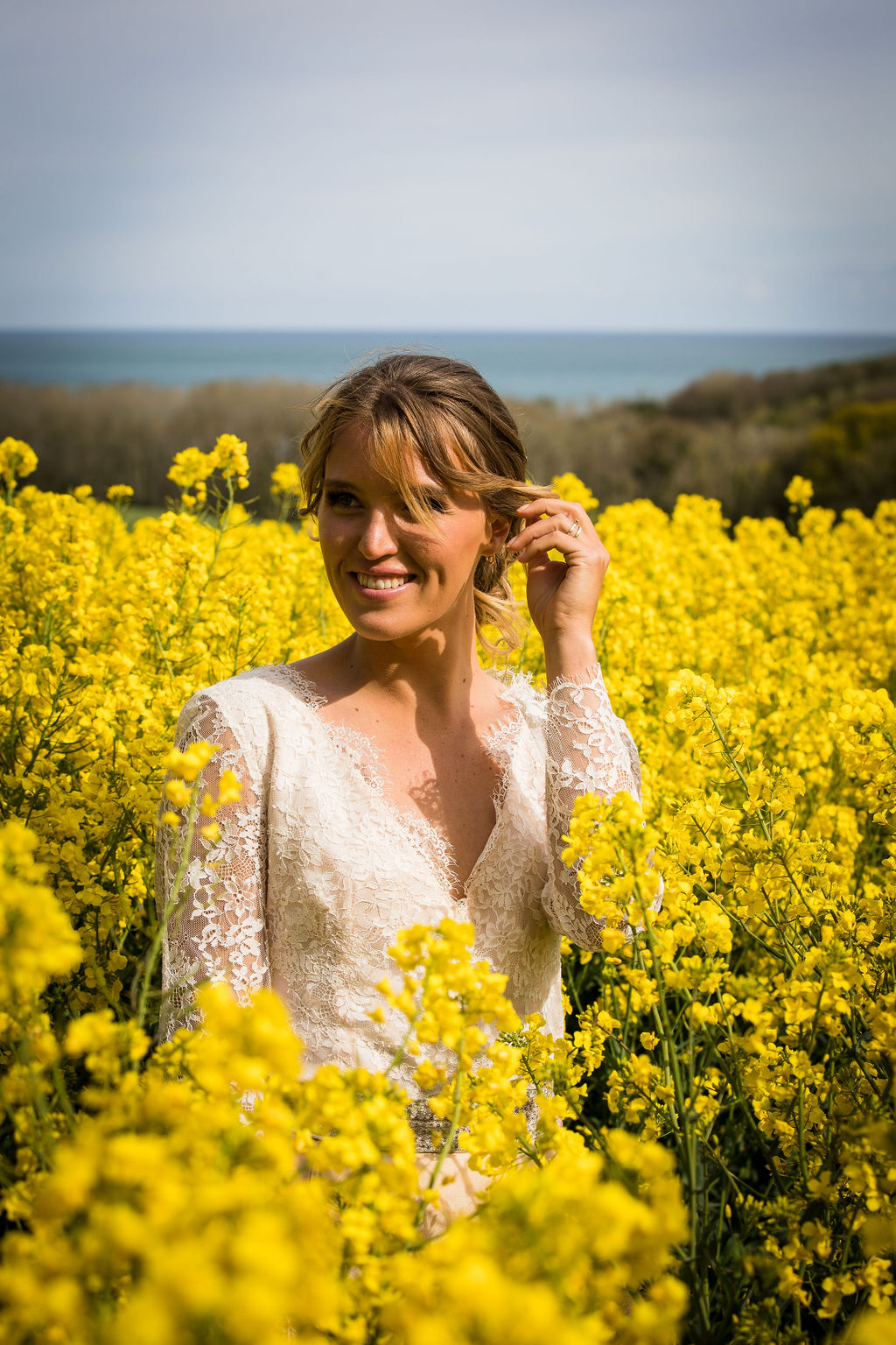 bride in field of yellow flowers - unique bridal portrait
