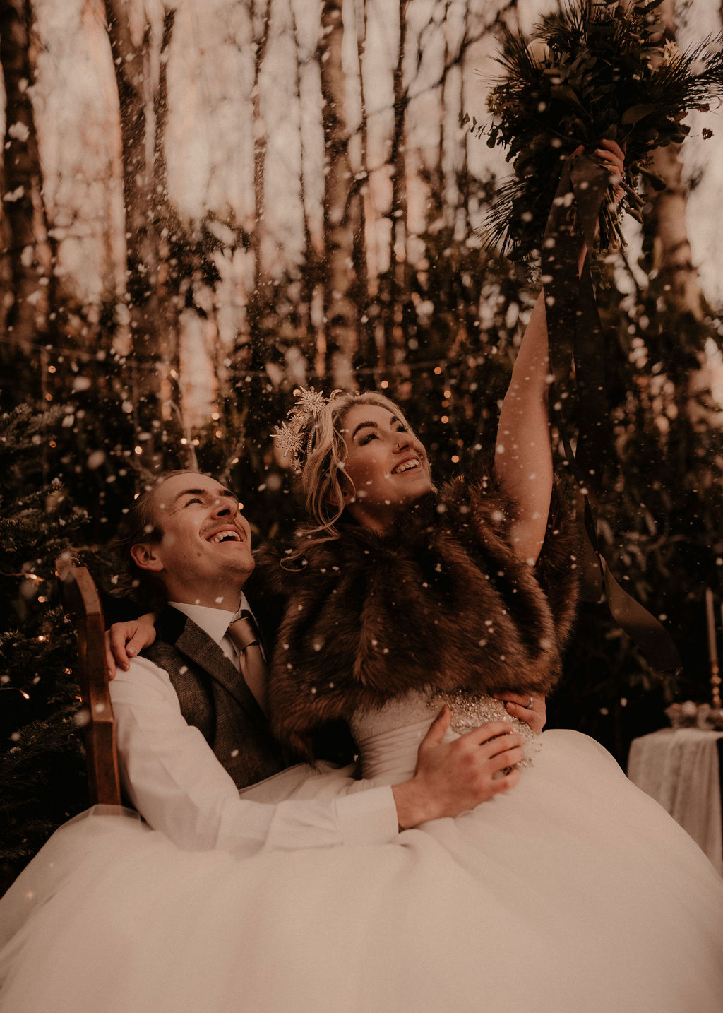 Winter wedding inspiration at sherwood glade, nottingham - couple celebrating in the snow