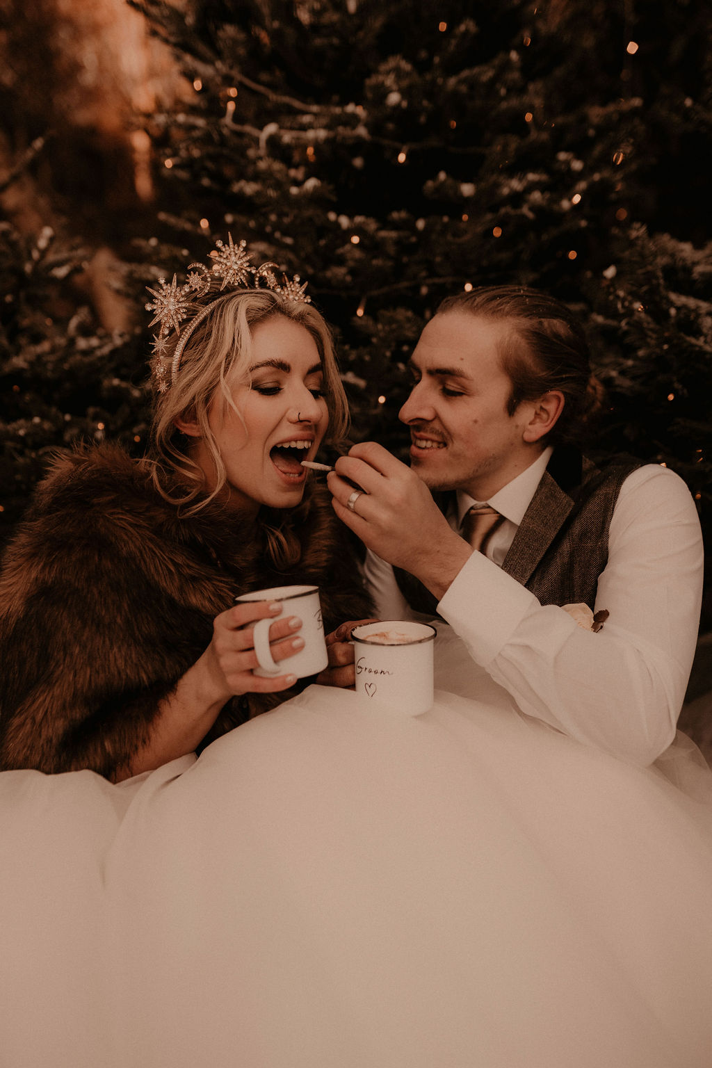 Elegant winter wedding inspiration in the snow - elopement wedding - couple drinking hot chocolate 2
