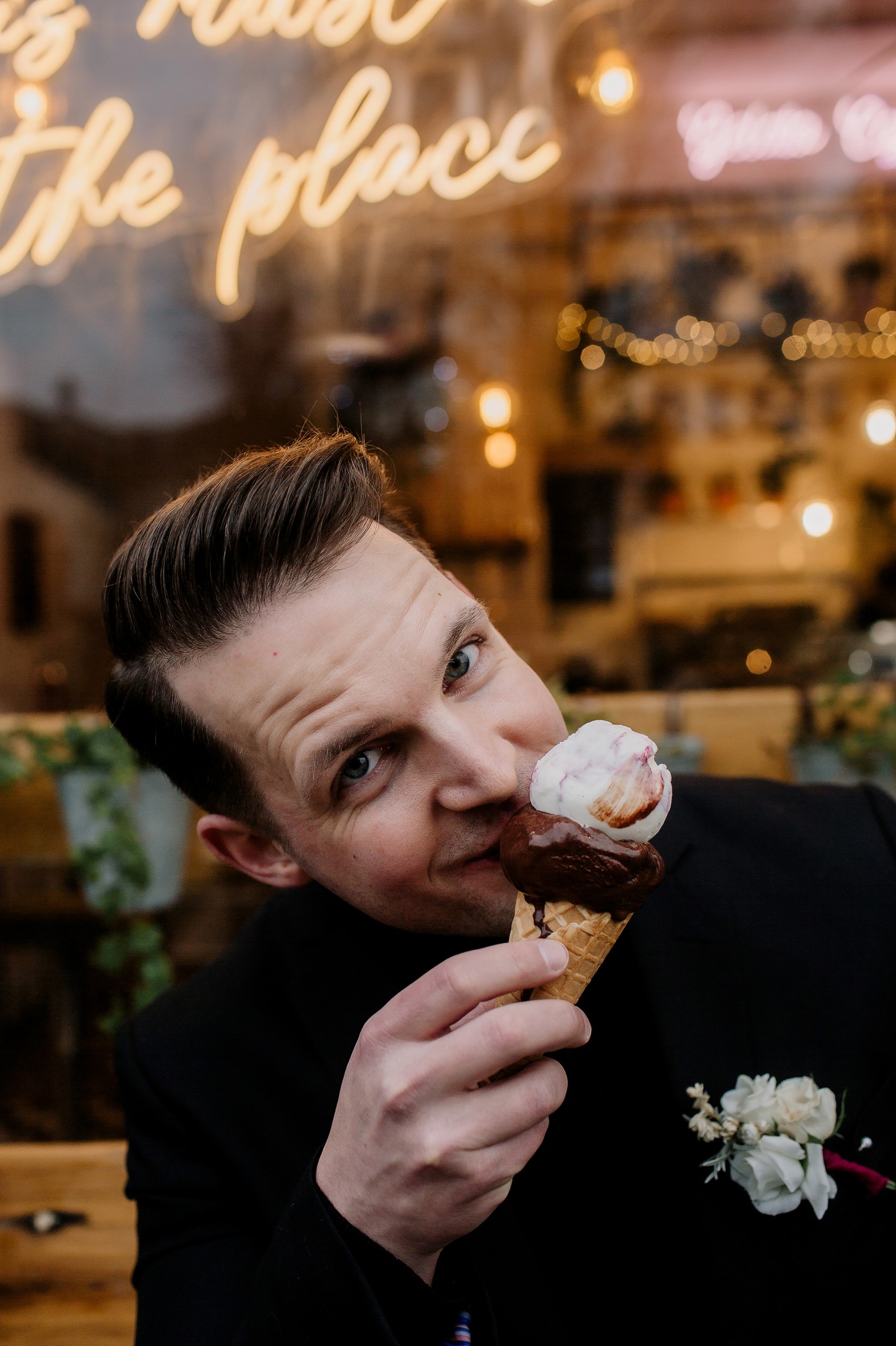 groom eating ice cream - fun winter wedding in Cambridge - city elopement - winter elopement - urban wedding ideas