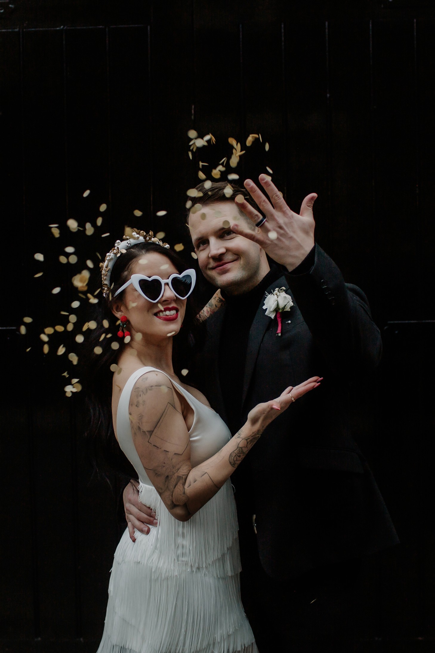 fun winter wedding in Cambridge - city elopement - winter elopement - urban wedding ideas - bride and groom throwing confetti