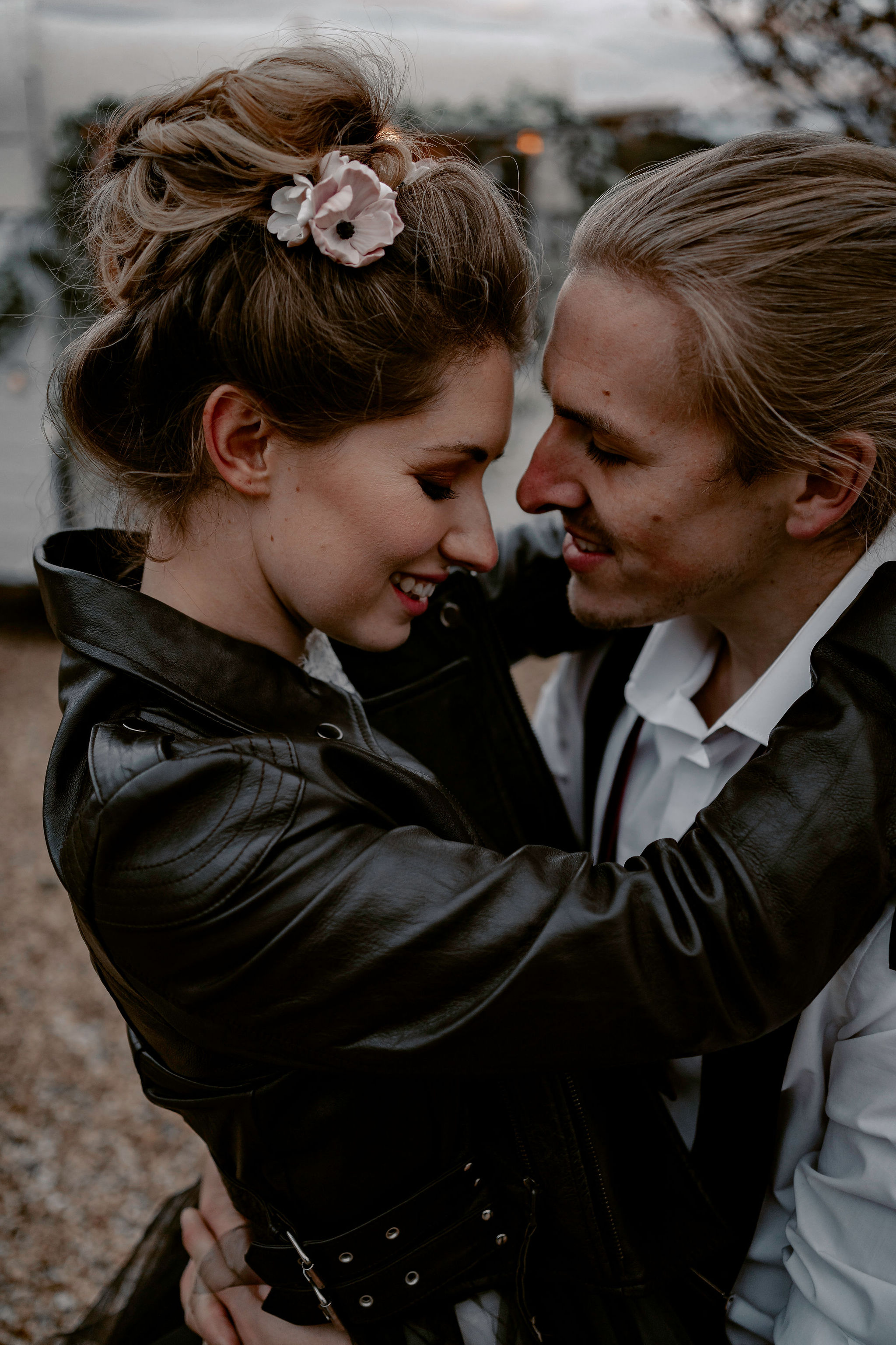bride in leather jacket and messy bun - alternative bridal wear - outdoor wedding looks