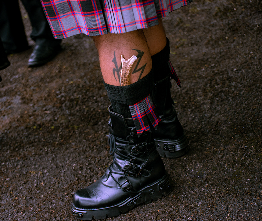 scottish gothic wedding - groom with kilt and gothic boots with bone in sock
