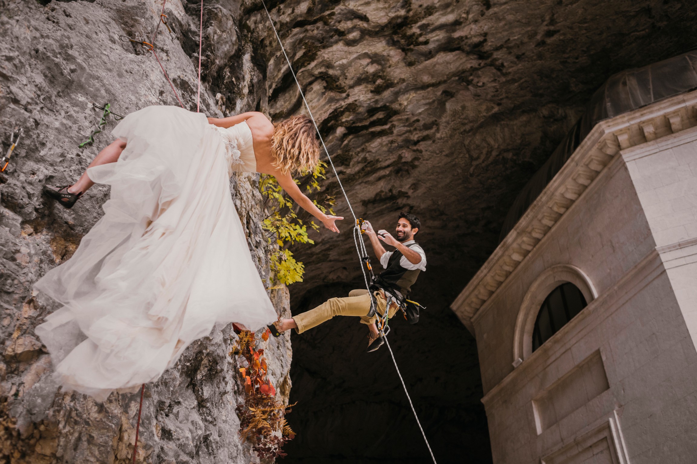 bride and groom rock climbing - outdoor adventure wedding - rock climbing bride
