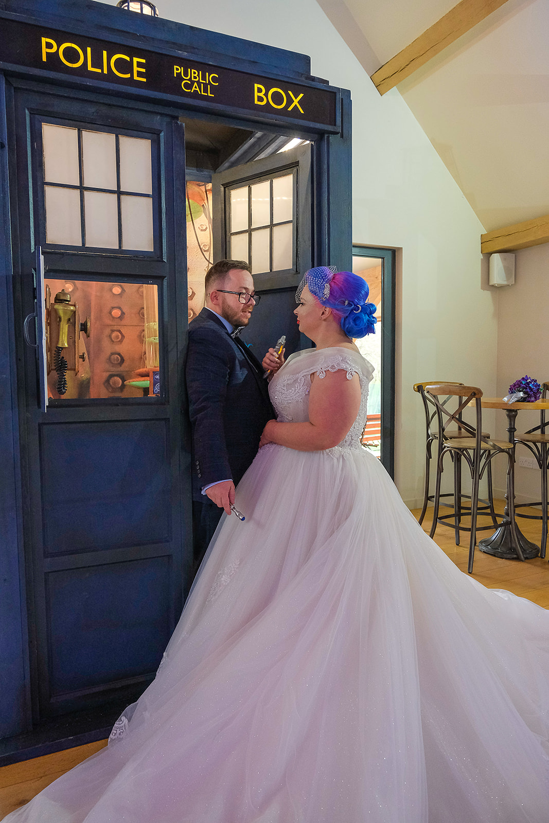 doctor who wedding - bride and groom stood by tardis - unconventional wedding