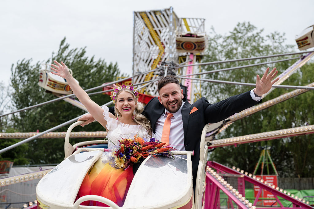 fairground wedding - bride and groom on a fairground ride - fun wedding ideas