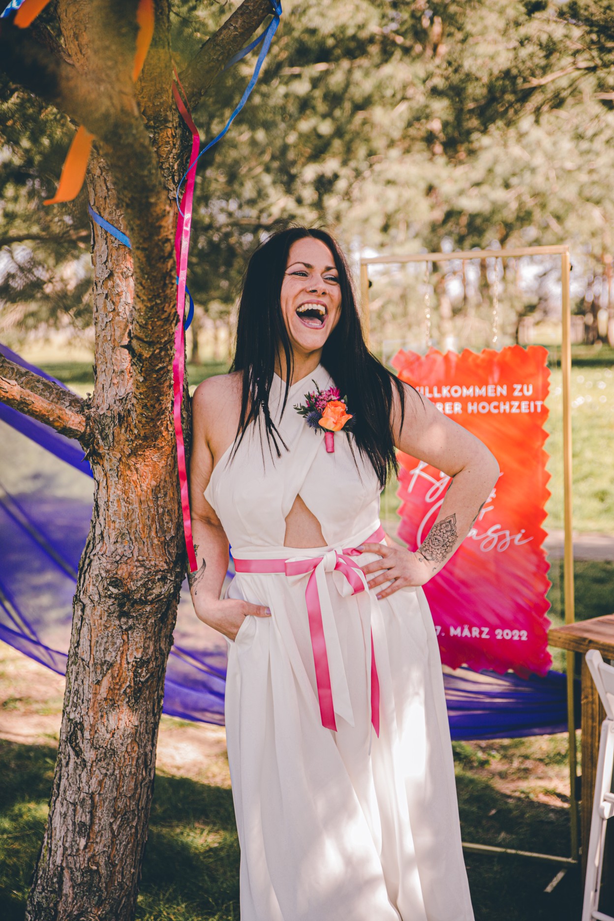 colourful outdoor wedding - backless bridal jumpsuit - pink and orange wedding ideas