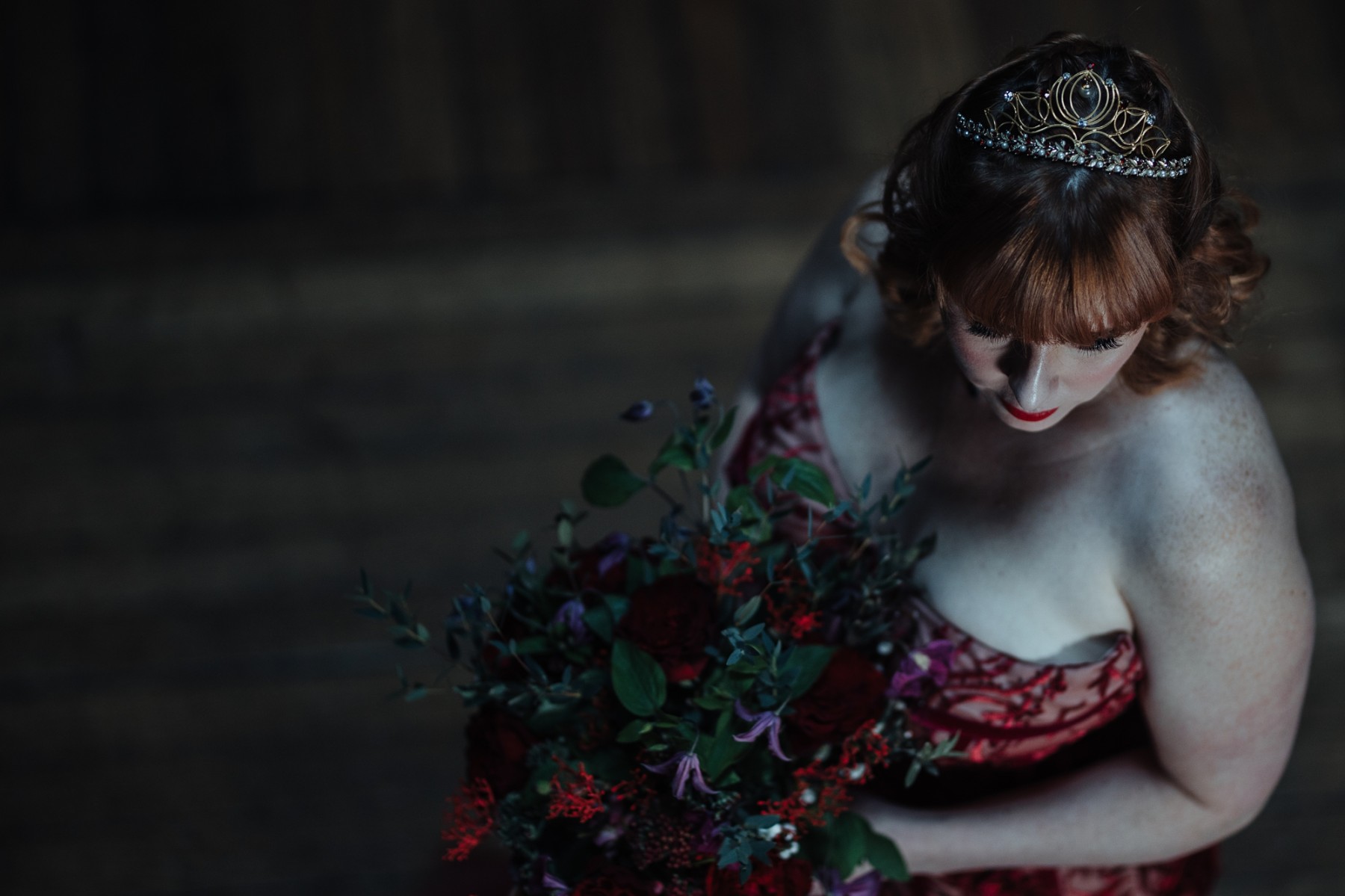 bride wearing a red wedding dress and bespoke tiara