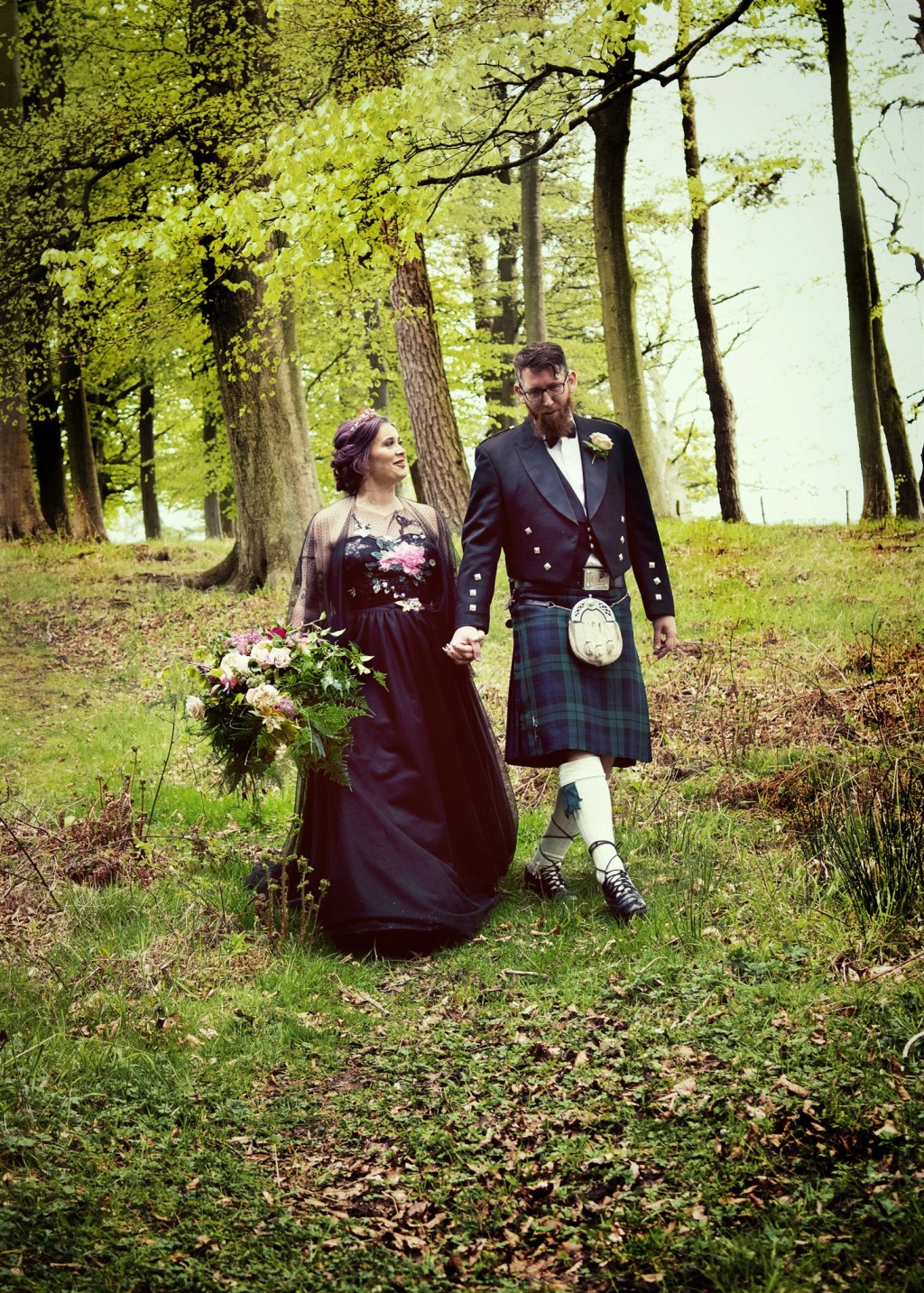 woodland wedding ideas - bride and groom walking through woods