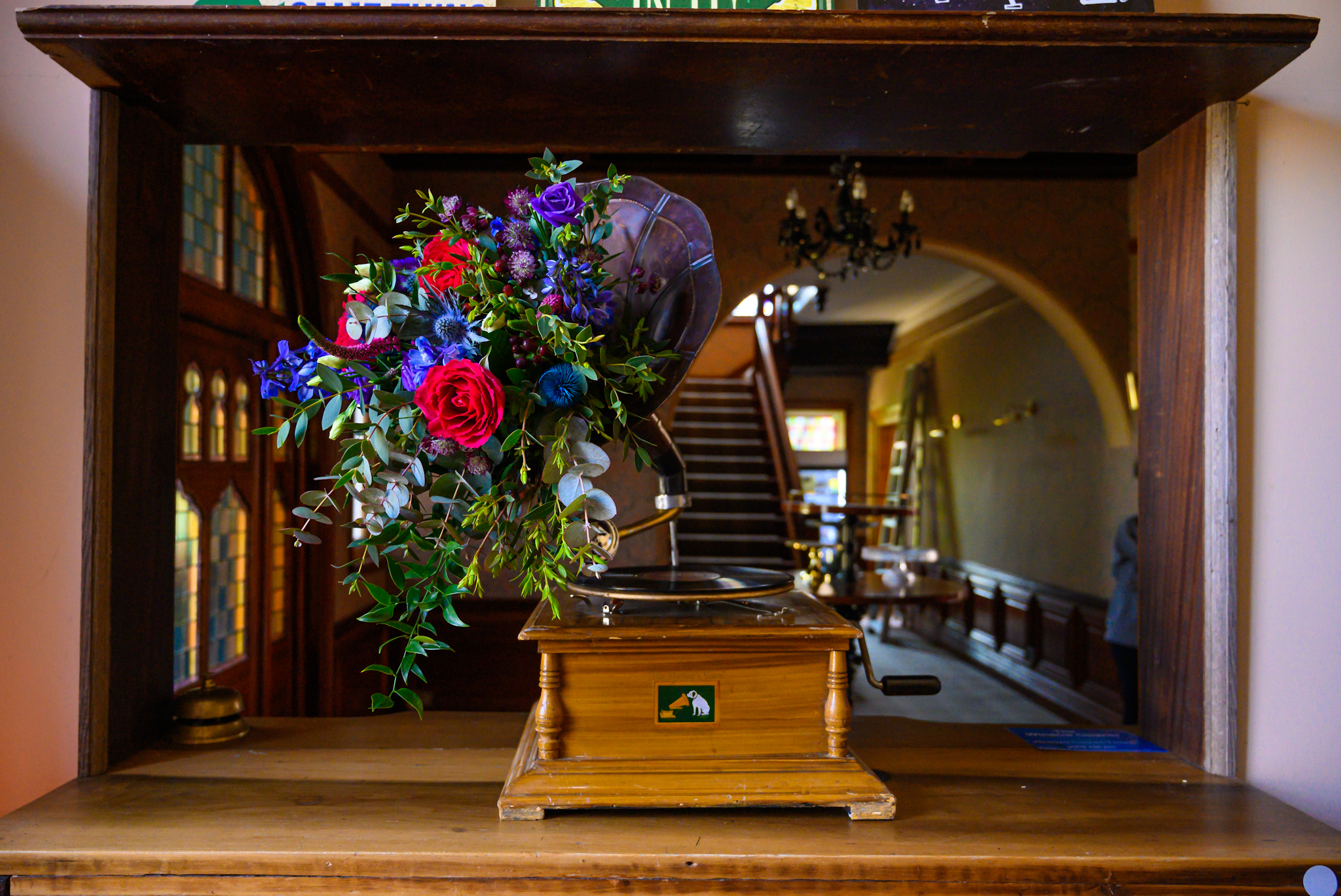 gramophone decorated with colourful wedding flowers