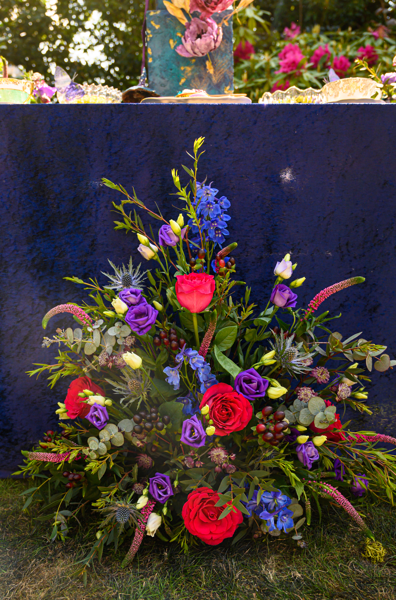 colourful wedding flower arrangement - red blue and purple wedding flowers