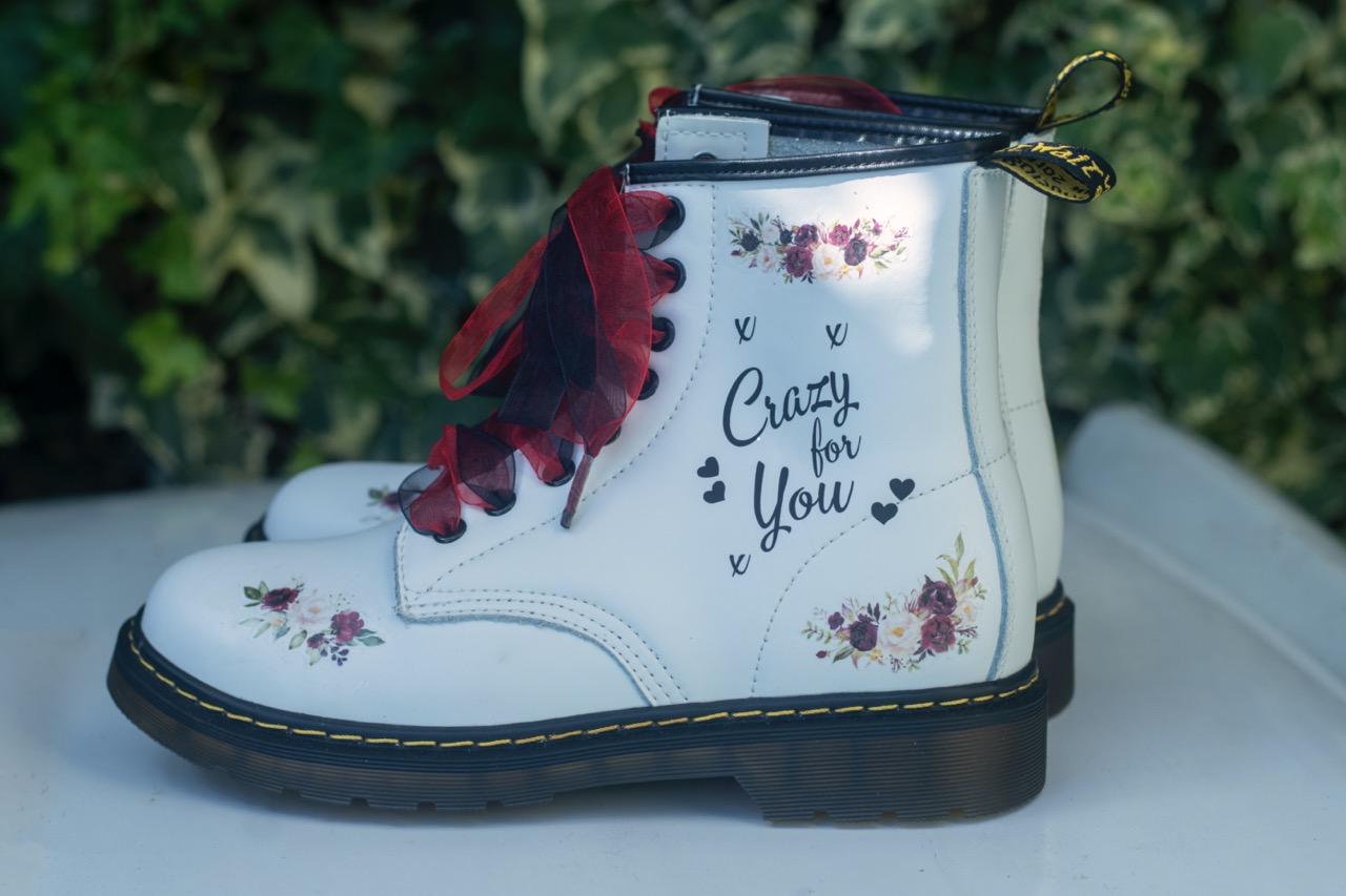 White hand painted wedding boots. Crazy for you with red ribbon. Alternative wedding shoes.