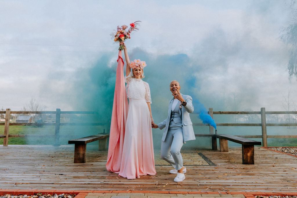 Colourful Smoke Bomb Wedding Photo with two people - pink and blue smokebombs at the Canary Shed - alternative essex wedding venue