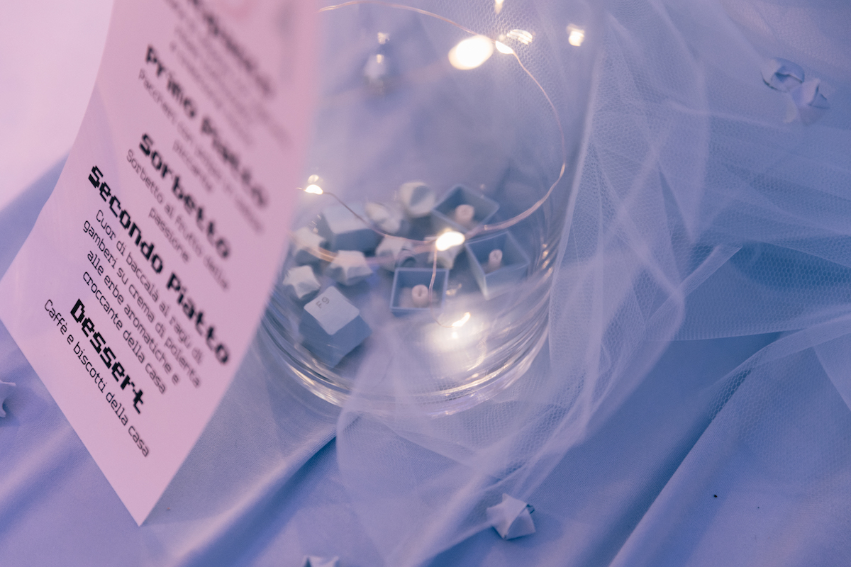 handmade video gaming inspired menu with keyboard keys and star table decor for DIY pastel pixel wedding