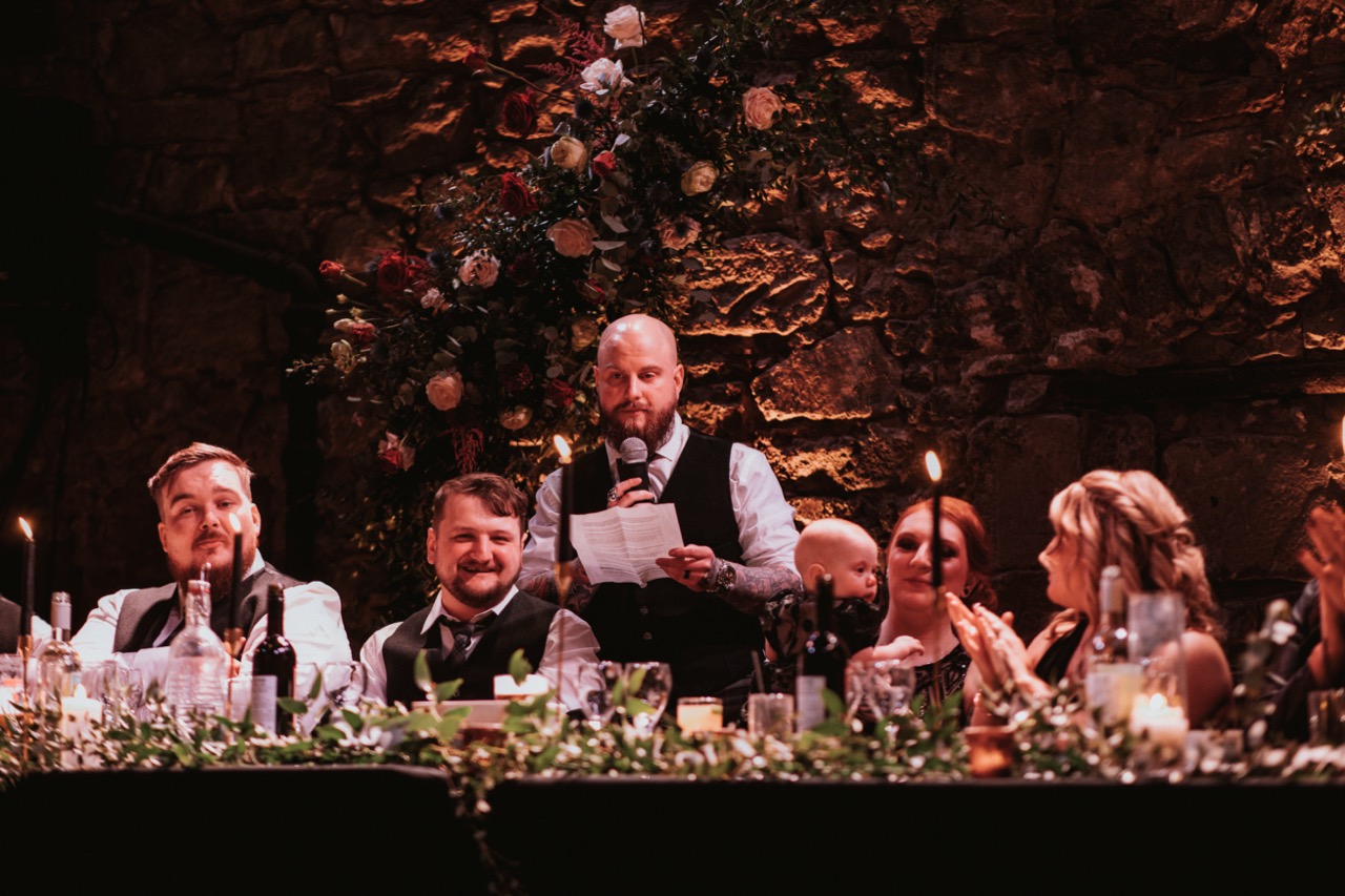groom giving speech at alternative wedding at the caves in edinburgh