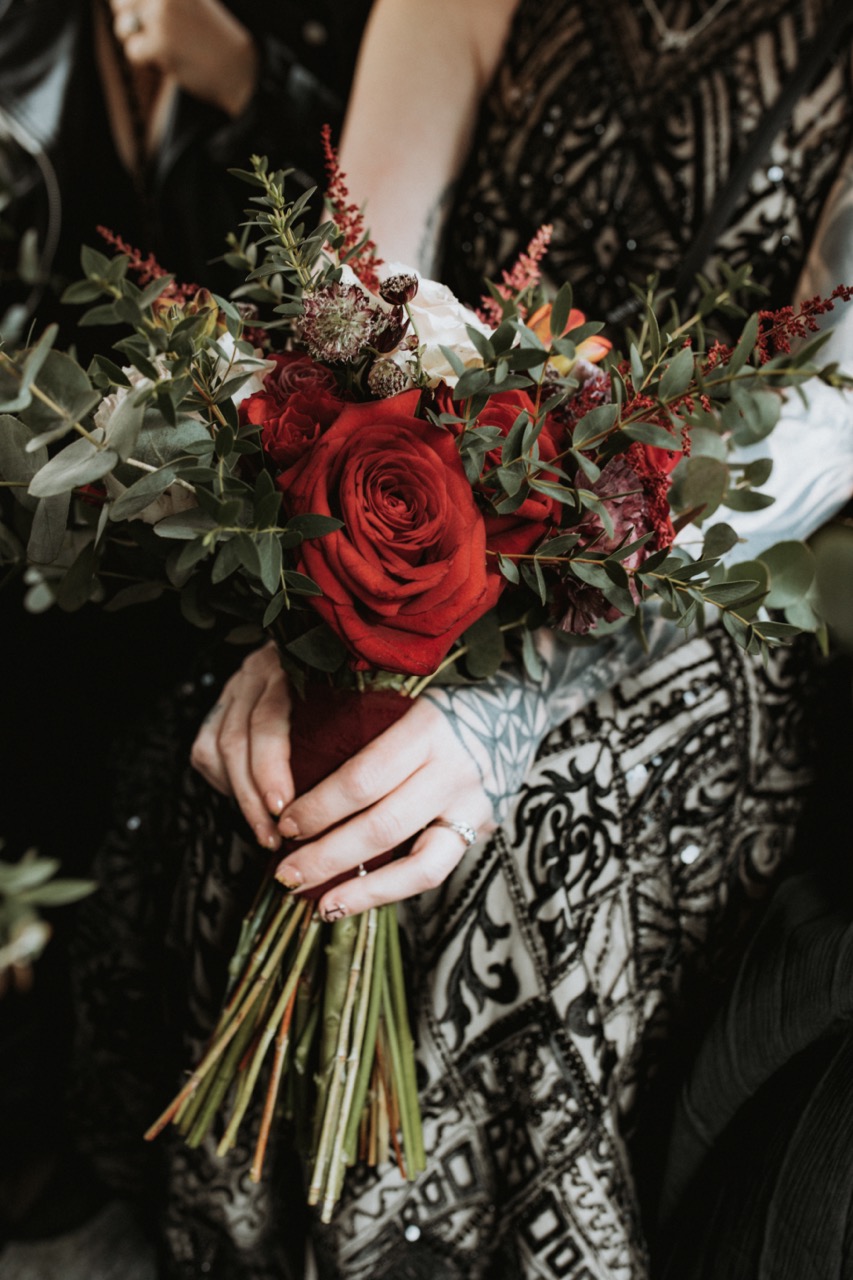 simple wedding bouquet with red roses and foliage - simple wedding flowers for alternative bride