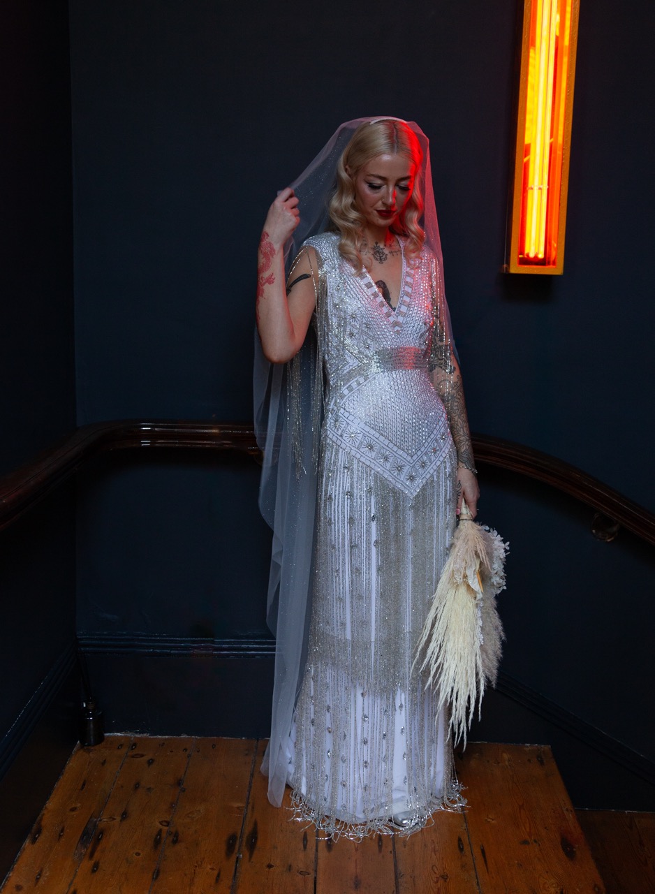 beaded wedding dress with 1920s detailing and silver sequins