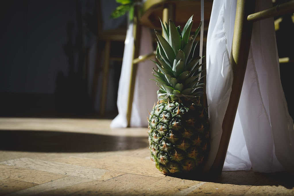 tropical themed wedding decor with pineapples