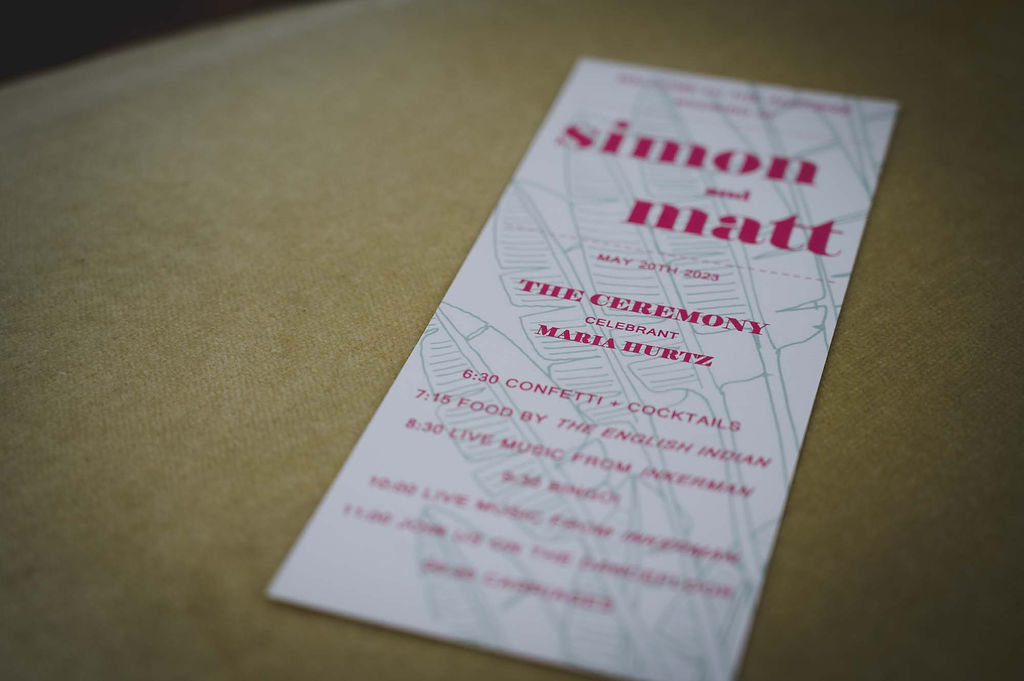 modern wedding stationery with pink text and plant drawings