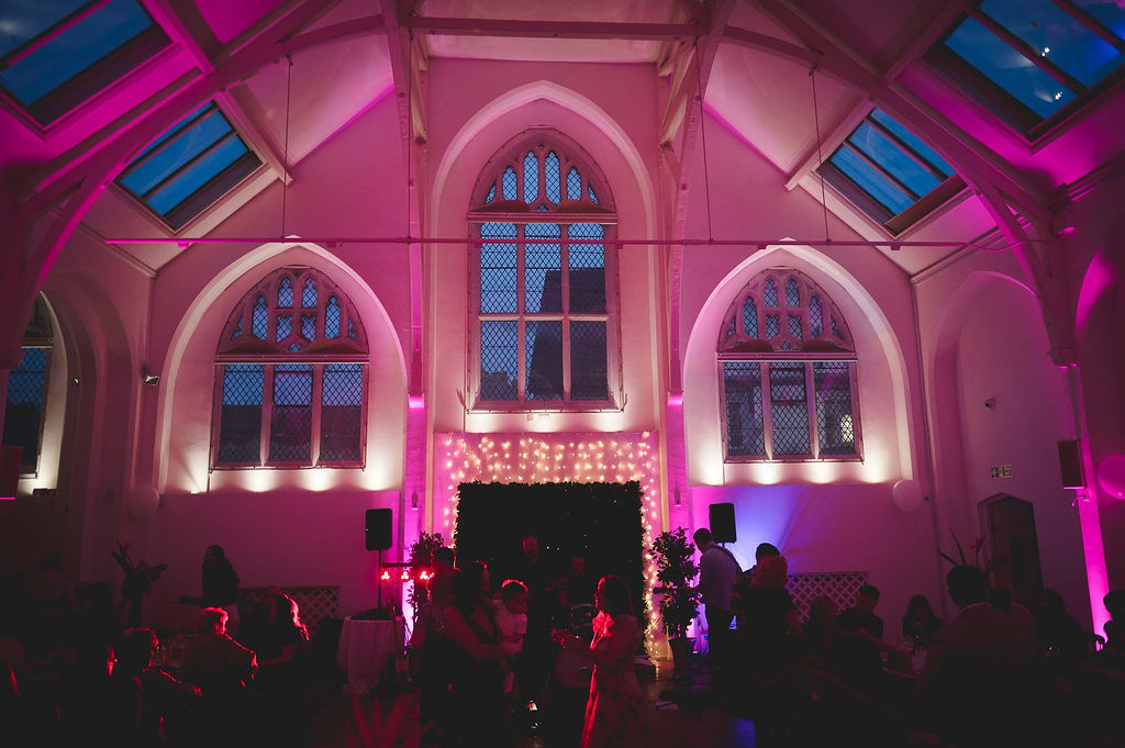 The Old Library, a unique wedding venue in Birmingham, lit up with pink lights